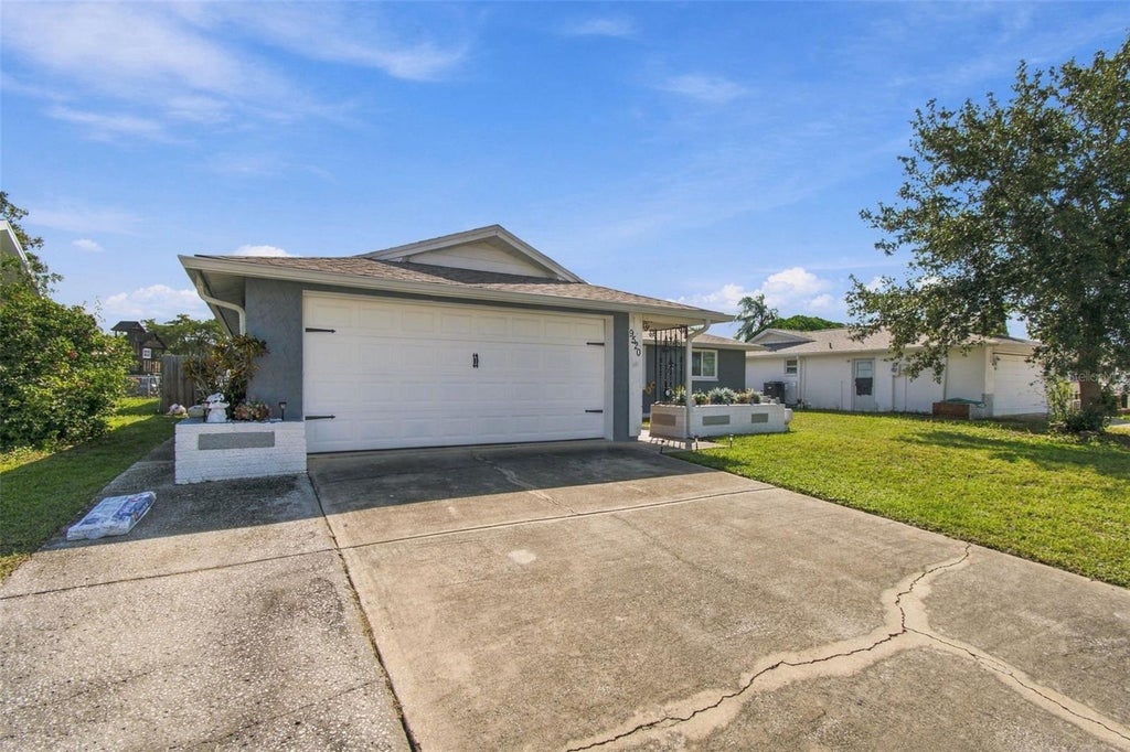 Photo of 9520 Glen Moor Lane, Port Richey, FL 34668 (MLS # TB8556873)