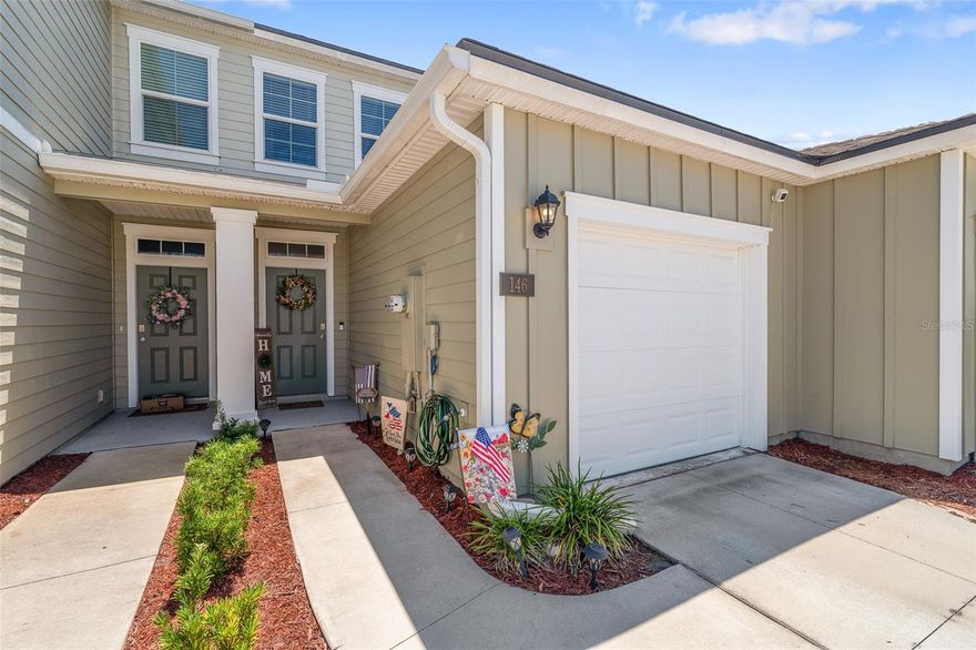 Discover easy, low-maintenance living in The Trails, Palm Coast’s newest gated townhome community. Set along a peaceful lake, this residence offers serene water views from several living spaces, including a screened patio perfect for morning coffee or evening unwinding. The open-concept design connects the kitchen, dining, and living areas, creating an inviting space for both everyday comfort and entertaining. The modern kitchen stands out with quartz countertops, an oversized island, abundant cabinetry, and a spacious walk-in pantry. Smart home features add convenience, including ceiling fans and smart switches that allow personalized lighting throughout the bedrooms, great room, and outdoor spaces. Ideally located just off Belle Terre Parkway, you’ll enjoy quick access to I-95 and US-1 for effortless commuting. Combining style, comfort, and convenience—this home is ready to welcome you!