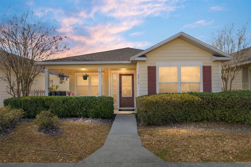 Located in the desirable Walnut Creek neighborhood, this 3-bedroom, 2-bath home offers 1,409 square feet of comfortable living space in a convenient setting. The welcoming front porch is a perfect spot for a morning cup of coffee. Inside, the home opens to a spacious living room with vaulted ceilings, creating an open feel. Two guest bedrooms are located to the right and share a hall bath with a tub/shower and linen closet. The kitchen and dining area feature a wall of windows, allowing plenty of natural light, along with a closet pantry for storage. The primary bedroom is privately situated off the kitchen and includes a large walk-in closet and a bath with a tub/shower and linen closet.
Just off the dining area is an outdoor patio, ideal for relaxed outdoor time. The laundry room is located beyond the dining area and provides direct access to the two-car garage. Recent updates include a new roof (2022) and HVAC system (2023). Conveniently located close to shopping, restaurants, the University of Florida, and offering excellent walkability, this home presents a great opportunity to make it your own in an established neighborhood.