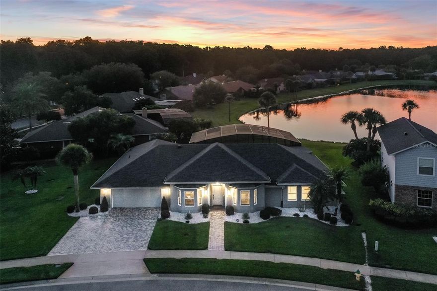 Stunning Custom Renovated Pool Home on Oversized Corner Lot in desirable Silver Lakes East. This beautifully upgraded 4-bedroom, 2-bath home sits on an oversized 1/3-acre corner lot with a picturesque view of a retention pond and fountain. Surrounded by lush, manicured landscaping, the property features 10-zone underground irrigation, paver driveway and walkway, and a fiberglass entry door that sets the tone for the elegance within. Inside, you’ll find 8’ and 10’ ceilings, real hardwood floors, porcelain tile in the bathrooms and laundry, and solid wood doors throughout. The home was completely custom renovated in 2020, including a new roof, full interior and exterior paint, plantation shutters on all windows, and automated shades on the sliding doors. Thoughtful upgrades include no-threshold flooring transitions, solid wood cabinetry, Cambria quartz countertops with backsplash, upgraded fixtures, under-cabinet lighting, and high-hat ceiling lighting. The gourmet kitchen is outfitted with top-of-the-line appliances including a built-in GE Monogram refrigerator, oven, glass cooktop, microwave, and wine cooler, plus a Bosch dishwasher and stainless-steel range hood. Bathrooms have been fully modernized, with the owner’s suite featuring an expanded walk-in shower, heated ceiling fixture, stainless grab rails, and a professionally organized walk-in closet. The outdoor living area is equally impressive: the pool and patio were completely renovated in 2023 and include a 50’ x 15’ insulated covered lanai with dual Hunter ceiling fans, a sparkling 19’ x 36’ pool with new equipment, all marble patio deck, screened enclosure, and electric heater with saltwater conversion ready to go. The pool bath is finished with custom cabinetry and a built-in blind within the glass door. Additional highlights include: a GENERAC standby whole-house generator with propane tank, all new tinted exterior windows and sliders, in-floor electrical receptacles, custom laundry cabinetry, Carrier variable-speed A/C with new ductwork and full spray foam attic insulation, and an ADT security system with 4 cameras. This home combines timeless craftsmanship with modern luxury, energy efficiency, and peace of mind—perfect for refined living and entertaining.  All this and more with unbeatable proximity to great schools, world-class attractions, shopping, dining, and bustling business districts, as well as major highways.  This property may be under audio/visual surveillance.