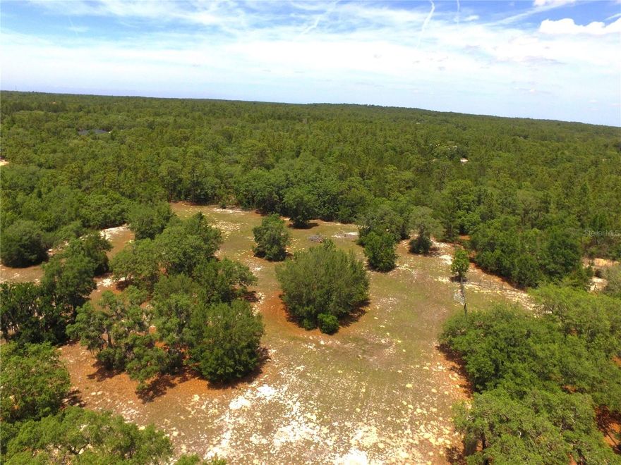 Looking for acreage to build your dream home? This beautiful 2.78-acre parcel located in the highly sought-after Pine Ridge community offers the ideal blend of privacy, space, and equestrian-friendly living in one of Citrus County's most popular neighborhoods. This property has already been cleared and perimeter fenced, saving you time and expense, while still featuring scattered mature oak trees that provide natural beauty and shade. Zoned for horses, this parcel is perfect for those looking to enjoy both a quiet and/or equestrian lifestyle, with nearby riding trails throughout the community. With the newly extended Suncoast Parkway just minutes away, this property is in a prime location for those wanting a quiet lifestyle and easy access to nearby metro areas.