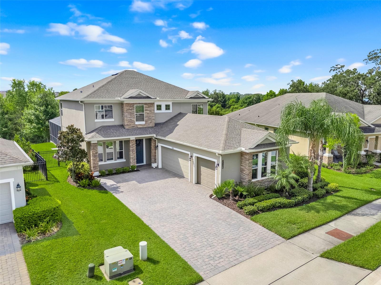 Welcome to this beautifully maintained 4-bedroom, 3.5-bath pool home in the heart of Winter Garden, built in 2017 and offering the perfect blend of comfort, privacy, and convenience. Nestled on a conservation lot with no rear neighbors, this home features a spacious screened-in saltwater pool and paver patio with a freestanding hot tub and covered seating area, ideal for outdoor living. Inside, enjoy an open floor plan with vaulted ceilings, abundant natural light, and a chef's kitchen complete with gas range, breakfast bar, and under-cabinet lighting, and custom pantry storage. The first floor features no carpet, while the second floor has brand-new carpet throughout, including a large loft perfect for a game room, office, or play space. Upstairs, two bedrooms share a full bath, while a separate fourth bedroom includes its own ensuite. Storage is maximized with custom-built systems in every closet and pantry, plus overhead garage storage and built-ins in the laundry room. The three-car side-entry garage adds extra curb appeal and functionality. Located in a community with a pool and playground, and just steps from walkable Sunridge Elementary and Middle Schools, this home is minutes from historic downtown Winter Garden, with quick access to theme parks and the airport.