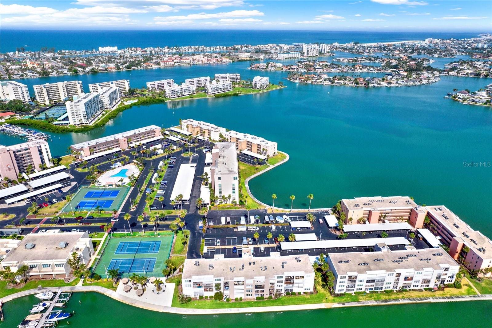 **Waterfront Condo in Bay Island – Ideal for Boaters and Outdoor Enthusiasts**
Welcome to Bay Island, a premier 55+ gated waterfront community in South Pasadena, Florida. This beautifully maintained one-bedroom, one-bath condo offers third-floor views of Boca Ciega Bay, where you can enjoy watching dolphins, manatees, and Florida's incredible bird life from your private balcony.
This residence features granite countertops, a glass tile backsplash, a breakfast bar, and an open living and dining area with luxury vinyl flooring throughout. The spacious bedroom includes two closets, and the unit is conveniently located just steps from the elevator. For added comfort and safety, the condo also includes electric hurricane shutters.
Bay Island is a boater’s paradise with a private marina offering slips available for purchase or lease, subject to availability. The community boasts a 1.5-mile waterfront walking path, six swimming pools, two hot tubs, tennis and pickleball courts, shuffleboard courts, a waterfront clubhouse with billiards, card and game rooms, a library, and a fitness center. There are also barbecue areas and lush landscaped grounds perfect for relaxing outdoors.
Located just minutes from the Gulf beaches, downtown St. Petersburg, and the vibrant restaurants and shops along Central Avenue. The iconic St. Pete Pier is a short drive away, and both Tampa International and St. Pete–Clearwater airports are easily accessible.
The monthly HOA covers basic cable, internet, water, sewer, trash, exterior maintenance, common area flood insurance, landscaping, and 24-hour gated security. HOA FEE INCLUDES FLOOD/EXTERIOR INSURANCE
Whether you’re an active retiree or simply looking for a tranquil waterfront lifestyle with unbeatable amenities, this home offers the perfect blend of convenience, recreation, and relaxation! Don't miss this one!