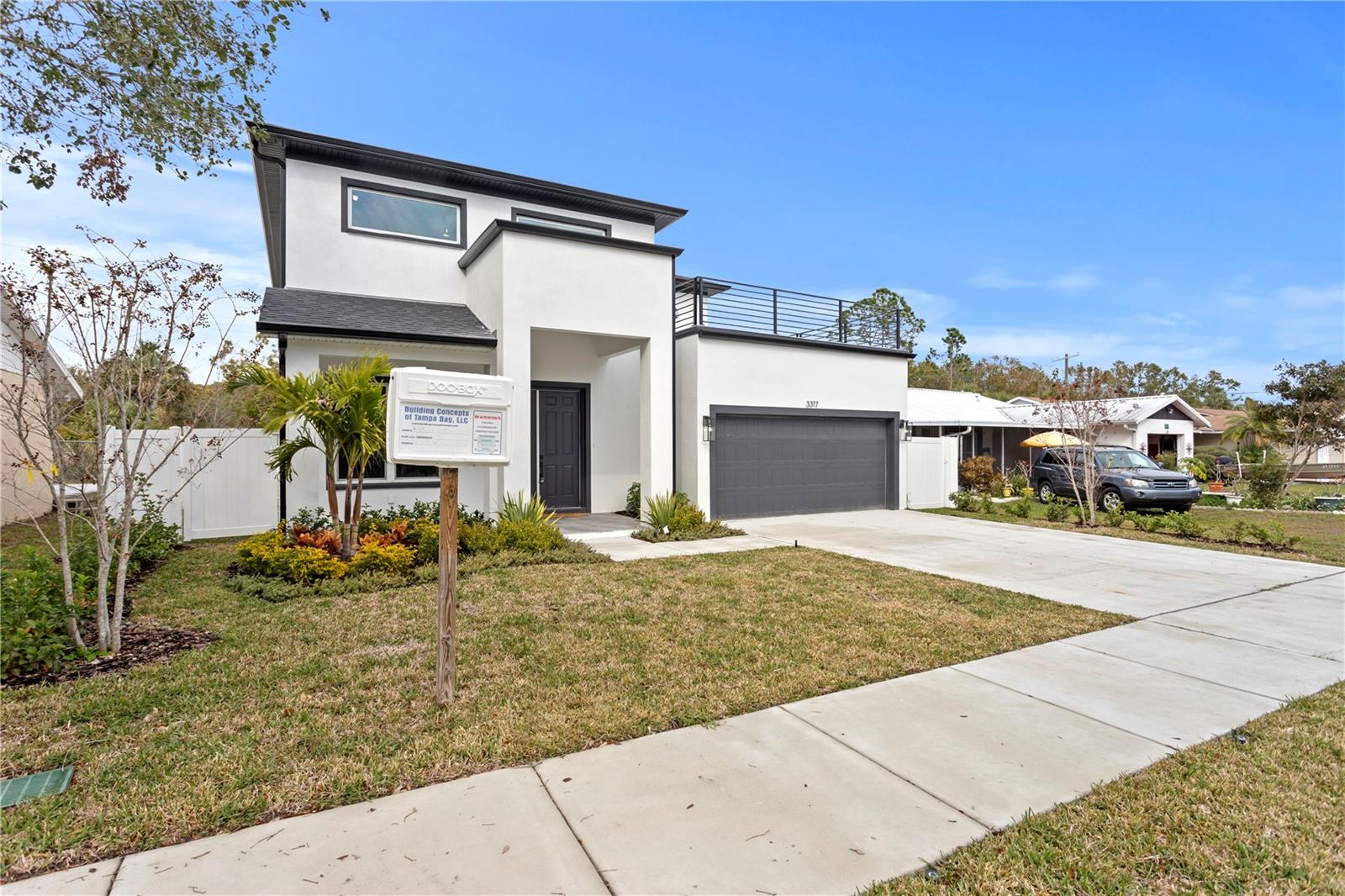 Welcome to this extraordinary new construction home in one of Tampa's most sought-after neighborhoods. This impressive property offers five bedrooms, including a flexible space ideal for a media room, man cave, or spacious bedroom. The home’s chic modern architecture and professionally designed landscaping make a striking first impression, enhanced by a front balcony that offers picturesque views. Inside, an abundance of natural light illuminates the stunning hardwood flooring and designer finishes throughout. The home is tailored for entertaining, featuring an expansive dining area and a gourmet kitchen with top-of-the-line stainless-steel appliances, luxurious countertops, custom cabinetry, and a breakfast bar at the oversized island. The entertainment area extends to a spacious, covered lanai and a resort-style backyard, perfect for dining or lounging year-round. Sitting on a generous 0.20-acre lot, this property has ample space for a future pool. The private family quarters include five bright, spacious bedrooms with ample closet space, while the master retreat boasts access to a private balcony, dual walk-in closets, and a spa-like ensuite bath.Additional highlights include a tankless water heater, a premium kitchen with granite countertops, solid wood cabinets, stainless steel appliances, and a gas water heater with quick-touch heating in the master bath. Located in prime South Tampa, this home is minutes from downtown, TIA, Bayshore Boulevard, and the beaches. Don’t miss this rare chance to own a brand-new, custom-built home without the wait of construction.
