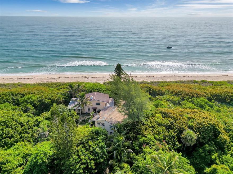 Welcome to Casa Bastian – “The Spanish House”.  This is your once in a lifetime opportunity to own an iconic world renowned beachfront property that has earned a spot on the top ten list of great places to surf on Florida's east coast. Located at the north end of Florida’s Treasure Coast, this location cannot be beat. With 100 ft of ocean frontage this almost 1 acre property has complete privacy. It is completely surrounded by government protected land that cannot be built on. There is only one other home south for 3 miles.  The RU2-4 zoning allows for 2 residential units. The age of the home may allow for special setbacks if the original structure is left in place(check with Brevard Co). The main home is 1696 htd sqft and has a large master bedroom upstairs with a 600+sqft wrap around balcony overlooking the ocean from the north, south, and east side of the home. Downstairs features an open floorplan with living, kitchen and dining areas, wood burning free standing fireplace, and a converted large bedroom downstairs that was previously 2 bedrooms, disappearing sliding glass doors lead you out to the 10x24 Florida room that overlooks the ocean and back yard. Out the back door you will find a large wood deck, outdoor shower, artesian well and its just 20 steps to the sandy beach. Detached 2 car garage with guest apartment on top. The 600 sqft guest apartment features 2 bedrooms, 1 bathroom, living room space, kitchen and dining areas, and a large 2nd story wood deck overlooking the ocean. Located 1 mile north of Sebastian Inlet State Park. This property offers complete privacy and it’s just a short drive to restaurants and shopping. Melbourne Beach is famous for it’s beautiful scenery, surfing, fishing, miles and miles of unspoiled beaches, and it’s laidback atmosphere.  The possibilities are endless with this magnificent property.  Don’t miss out on this opportunity to own your own slice of paradise.