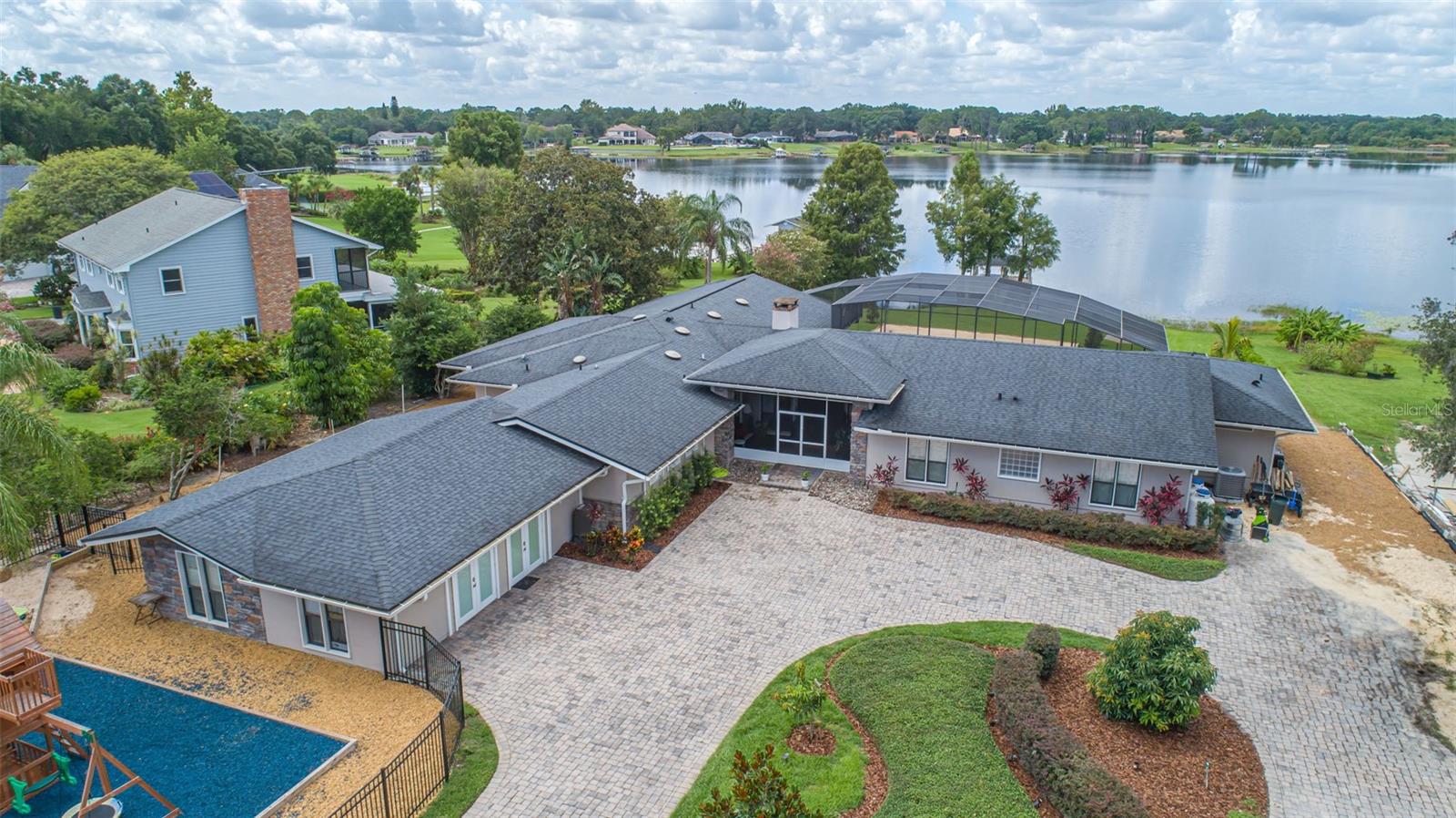 A RARE FIND doesn’t even begin to describe this stunning lakefront home in Windermere on 4.64 acres! This home is located on one of the most beautiful waterfront lots in all of Windermere if not all of Central Florida!!! Located on Crescent Lake, in the Crescent Lake subdivisions where lakefront lots rarely come available; this is an opportunity you don’t want to pass up if you love incredible sunsets with panoramic views, watching Disney Fireworks every night from your patio, large front and rear lawns, 141 feet of lakefront shoreline and a boat dock with a lift. There is no other lot available on the Butler Chain of Lakes with the views and potential to make it your own that this home and lot provides. The light, bright, open floorplan offers high ceilings, a private owners suite, 4 to 6 bedrooms, an office, billiards/game room, home gym/flex room, screened pool/spa and a detached storage building for all your lake gear and toys or a remote office from the home. The opportunities this home offers are endless. Neighboring new homes offered in the $3M+ range that don’t have the view or lake access that this one does. Minutes from I-4, downtown Orlando, Disney Springs restaurants and shopping, Orlando International Airport, Disney, Universal, SeaWorld, and all other Central Florida attractions. Enjoy all your favorite water sports, great sunsets, and a home with room to have family and friends come for visits and stay for a while! More photos coming soon. Call for your private viewing appointment immediately.