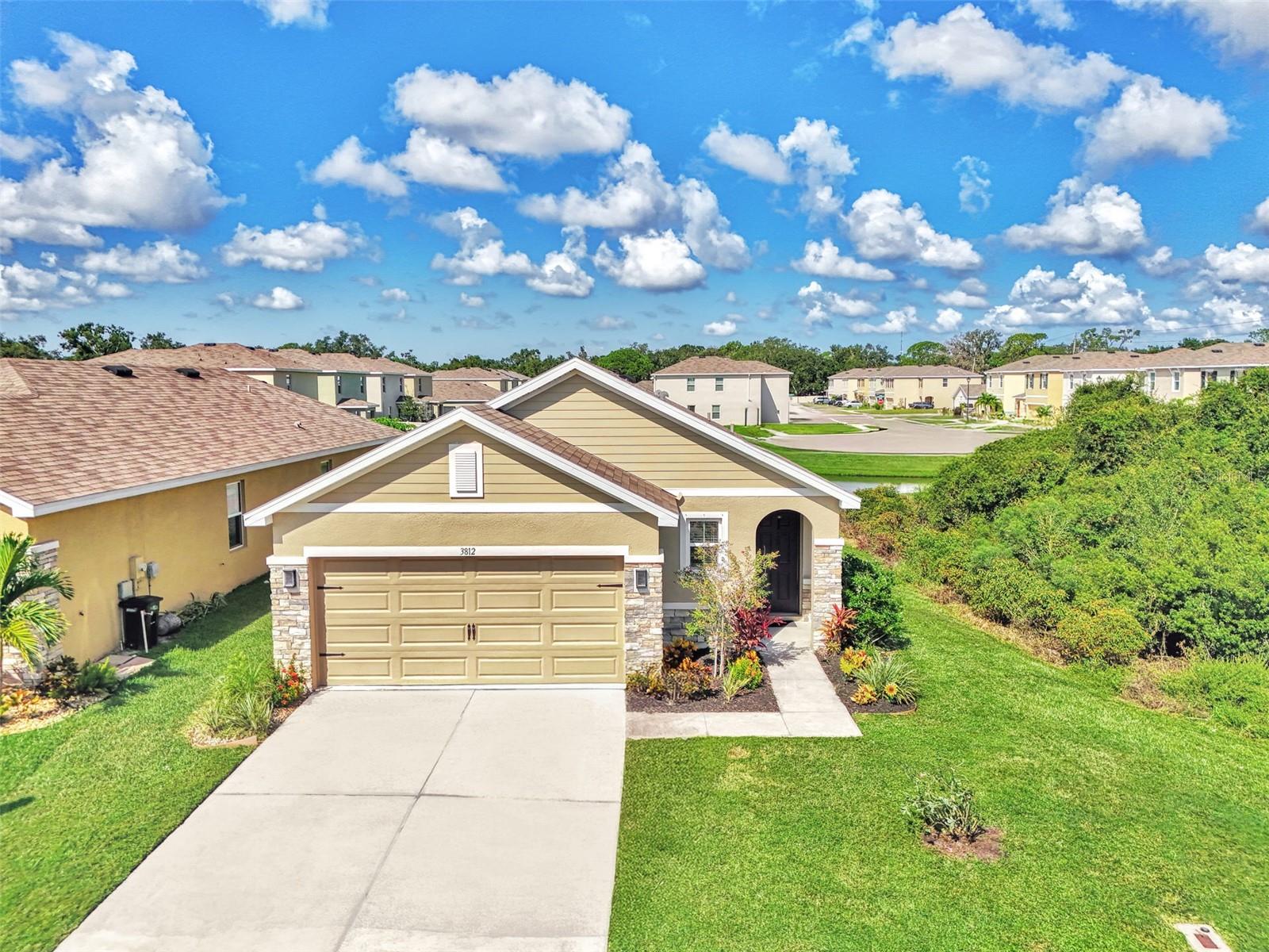 WELCOME to your Serene Sarasota Retreat overlooking a tranquil pond with Spectacular Sunsets. This beautiful newer construction home was built in 2021 and is a well maintained home perfectly positioned on a picturesque pond and parallel to a tranquil nature greenbelt, in a gated community. This home is situated on what's considered one of the best lots in the community due to the private setting with no home on the rear of north side. This great floor plan has a open concept kitchen offering a kitchen with granite countertops, stainless steel appliances, and plenty of cabinet space along with a closet pantry. It has a separate little dining area and breakfast bar as well as a separate dining room ideal for both entertaining and everyday living. The peaceful spacious primary suite is secluded from the secondary bedrooms with a walk-in closet, walk in shower and a dual vanity sink, while taking in the beautiful views of the pond. The additional two bedrooms provide comfort and flexibility for family or guests. The guest bathroom has a tub/bath combo for your relaxation needs. Off the living room, step outside to your picturesque, west facing, screened lanai and take in the serene water views, lush greenery, and an abundance of nature - including turtles, fish, birds, rabbits, and much more - a perfect backdrop for morning coffee or evening gatherings with AMAZING sunsets. The nature greenbelt ensures added privacy and a constant connection to the outdoors. Centrally located in Sarasota, this very family friendly community offers plenty of shopping and restaurants minutes away - as well as being minutes from I-75, making this home perfect for commuters. This home is a 20-25 minute drive from downtown Sarasota and award-winning Gulf beaches including Siesta Key. With shopping, dining, and top-rated schools, this home offers a rare combination of peaceful nature and city convenience. This house is priced to sell and it depicts Florida living at it's finest! Schedule your private showing today!!
