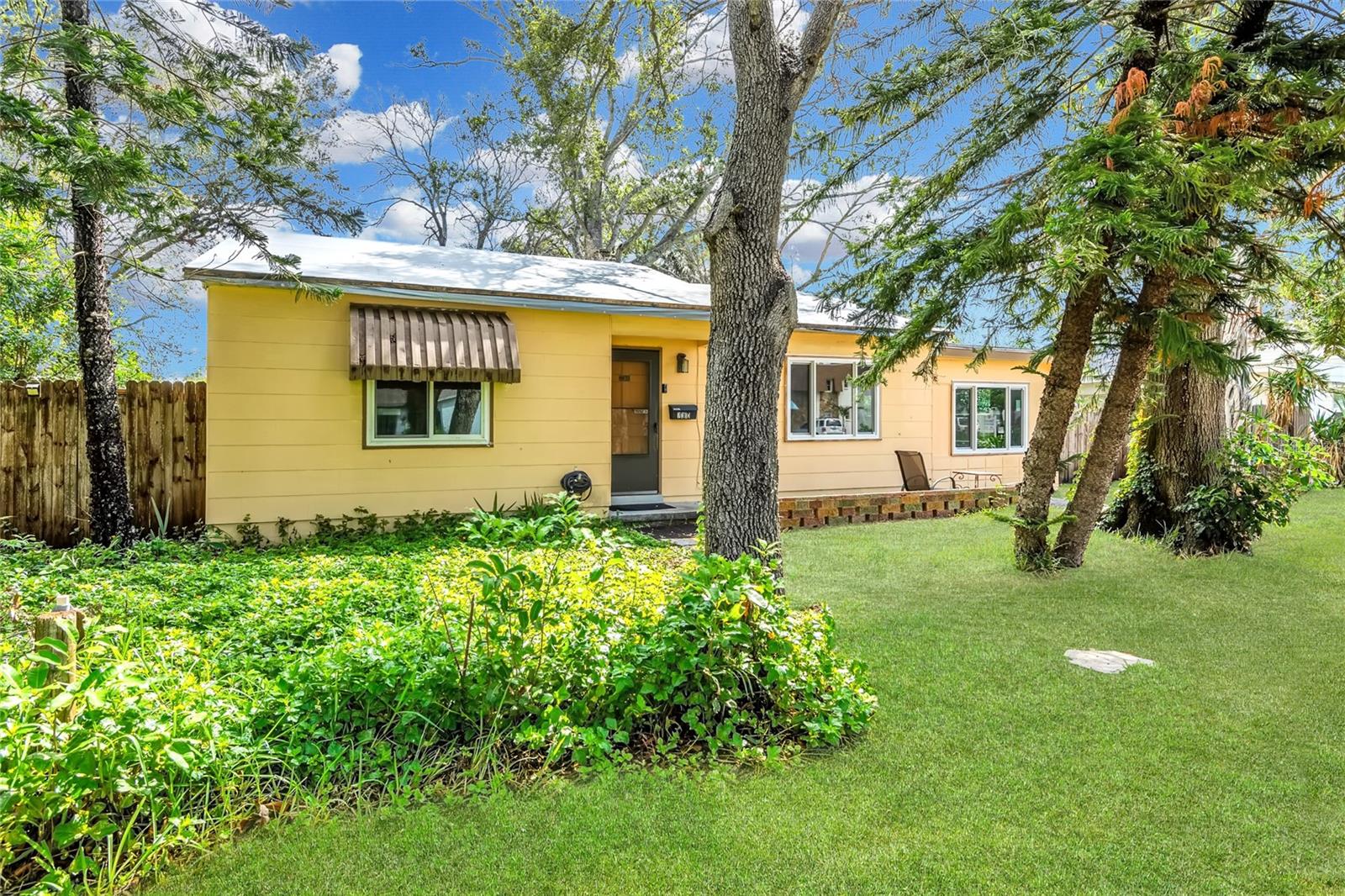 Discover the potential of this 2-bedroom, 1-bathroom home perfectly situated in the peaceful and sought-after Pasadena neighborhood. While the home did experience flooding during last years hurricane, it presents a unique opportunity for renovation or redevelopment and is being sold as-is. Roof was replaced in 2017 and there are brand new hurricane impact windows and slider giving you a head start on restoration or customization. The oversized lot at over 1/4 acre, is nested among mature landscaping and trees, a perfect setting for any backyard you desire. Enjoy close proximity to shopping, dining, and world-famous Gulf beaches, plus easy access to vibrant downtown St. Petersburg—just 15 minutes away. Whether you're an investor, builder, or buyer with a vision, this is a property you don’t want to miss!