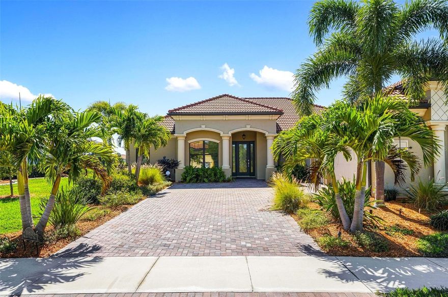 NEW IMPROVED PRICE! The UNOBSTRUCTED GOLF AND LAKE VIEWS ARE STUNNING. OVER $200,000 IN UPGRADES! Here is a unique opportunity to own a beautiful, designer decorated Estate home on an OVERSIZED LOT within the highly sought after gated community of Sarasota National. The home includes 2 FULL GOLF MEMBERSHIPS with the quarterly HOA fee providing convenient and effortless access to a great golfing experience. Located on a quiet cul-de-sac, this home exudes quality and luxury at every turn.  The SOUTHERN EXPOSURE provides sun all day and the amazing Florida sunsets and sunrises are not to be missed. Upon entering the home, you will immediately appreciate the spacious interior that flows effortlessly from room to room. EASY CARE, WIDE PLANK LUXWOOD FLOORING IN ALL MAIN LIVING AREAS for added comfort.  Two sets of sliding doors and walls of impact glass windows flood the home with natural light, perfect for everyday Florida living. All windows have the benefit of 3M solar film to reduce glare and UV intrusion. The home has been EXTENSIVELY UPDATED.  The kitchen is a chef's dream with high-end stainless-steel appliances and a huge center island with quartzite and backsplash all with an exotic leather finish. The custom solid maple wood cabinets feature dovetail constructed drawers, soft closing feature, solid wood pull outs for easy use storage and under and over cabinet lighting from Phillips Hue. The primary suite is a peaceful and luxurious retreat with a French door to the lanai and a large walk-in custom fitted closet. The ensuite bathroom features an oversized seamless glass walk-in shower tiled floor to ceiling in porcelain tile with rain shower and Grohe push button shower control. His and her vanities with ultra-premium marble counters, LED backlit mirrors and a corner bench with lots of storage. There are two additional guest bedrooms as well as his and her offices. His office could be a 4th bedroom. The laundry is effortless with top-of-the-line LG washer and steam dryer and mini washer underneath. Additional luxury upgrades include impact windows, PRE-WIRED AUDIO WITH VOLUME CONTROLS AND SPEAKER SYSTEM IN MAIN ROOMS, whole house water treatment system, hand-made poplar wood plantation shutters, porcelain tile from Italy and Spain, and PIONEER AIR CONDITIONING IN the large 3-car GARAGE. Step outside to enjoy outdoor entertaining on the expansive screened lanai complete with a beautiful sparkling heated pool and spa. Ample room for lounging and eating in the shade or sun. The lanai is surrounded by palm trees to ensure complete privacy. Stunning lake and golf views in all directions. Sarasota National is a master plan community with many lakes, nature preserves and the most amazing wildlife every day and includes an 18-HOLE Audubon Silver Certified Sanctuary designated CHAMPIONSHIP GOLF COURSE, pro shop, 30,000 sf clubhouse with bar, a fine dining restaurant, 19th hole restaurant, zero-entry Resort-style pool, Day Spa, Tiki bar, Tennis, Pickleball and Bocce courts as well as a 7,358 sf. Fitness center with high end equipment, classes and personal trainers, Coffee lounge, Library, Playground and Dog park for our furry friends. This home is just minutes from the Atlanta Brave's spring training camp at Cool Today Park Stadium as well as the Wellen Park town center. This is a one-of -a-kind opportunity and is more than just a home, it's a lifestyle. Schedule a showing today.
