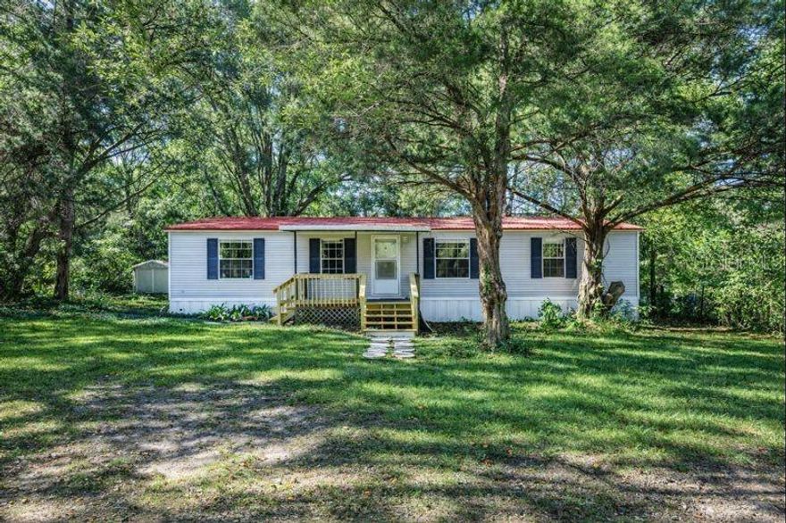 One or more photo(s) has been virtually staged. Check out this beautiful 3-bedroom, 2-bathroom home situated on over 5 acres in Alachua, FL. Offering exceptional privacy and plenty of room to roam, this property is perfect for anyone who loves the outdoors. Inside, you’ll find an inviting open floor plan ideal for entertaining, along with durable tile and vinyl plank flooring throughout for easy maintenance. Enjoy the best of both worlds with peaceful country living just 15 minutes from Gainesville and downtown Alachua, keeping you close to all the conveniences of shopping, dining, and entertainment. Outdoor enthusiasts will love being just a short drive from iconic natural attractions like Ginnie Springs and the Ichetucknee River. The property also includes an oversized carport to protect your vehicles and equipment, and the mostly cleared acreage is well-suited for pasture land or animals. Call today for more information—this home won’t last long!