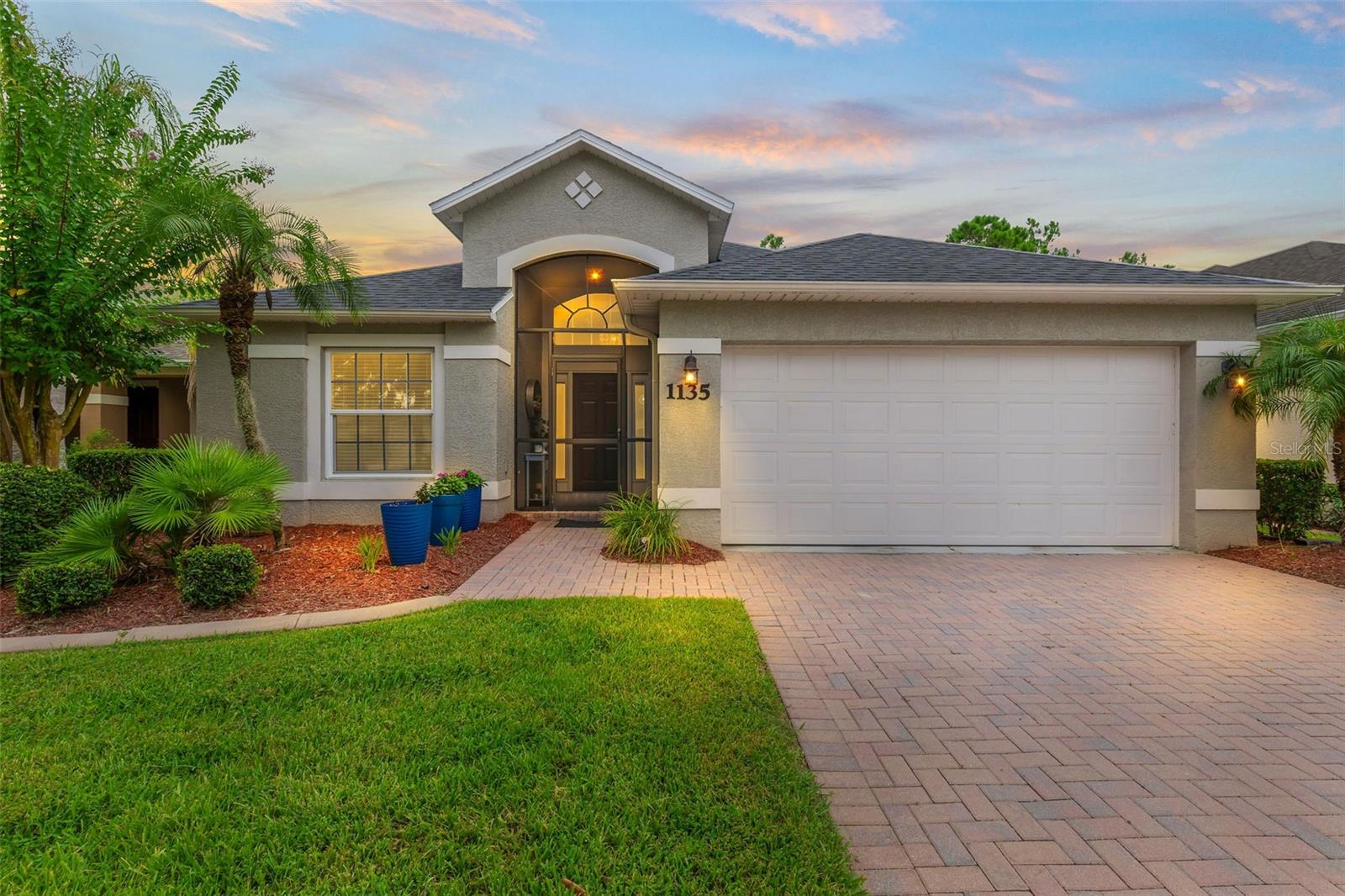 Walk in to an amazingly well-renovated home with tons of charm! This beautifully remodeled Cayman model home with only a five-year-old roof, as well hurricane impact windows (2018), is concrete block and will offer security and comfort. Meticulously maintained, you will love the paver driveway leading up to a two-car garage and a screened front patio area. You will be so impressed with the thoughtful renovation that offers luxury vinyl flooring throughout, two living room areas for entertaining, a breakfast bar, a lovely screened porch with plenty of room for seating, and much more. This house is a show-stopper, offering volume ceilings, niches, and a split bedroom plan. The updated guest bathroom with frameless shower doors and lots of contemporary style provides comfort as well as style. The primary suite is large and offers an ensuite bath and a huge walk-in closet. The kitchen provides lots of counter space for the cook in your family, quartz counters, stainless appliances, a tiled backsplash, cobalt cabinets, and a very spacious pantry. You will enjoy the low maintenance and seamless look of laminate flooring in living areas and bedrooms. This home features newer fans, lighting, toilets, and a transferrable termite bond. Enjoy peaceful mornings on the screened porch with a water & conservation area view! A golf cart path behind the home leads to the Par 3 practice area, so you won't see much traffic driving by! This home is a short walk or bike ride to the LPGA Clubhouse for dinner, golfing, swimming, or socializing. LPGA is also a stone's throw from all of the entertainment options like Tanger Outlets, Bucees, PopStroke, I-4, and I-95, and only 15 minutes to the area beaches. You simply can't beat this location in terms of being central and close to all the great restaurants and conveniences. All information taken from the tax record, and while deemed reliable, cannot be guaranteed.