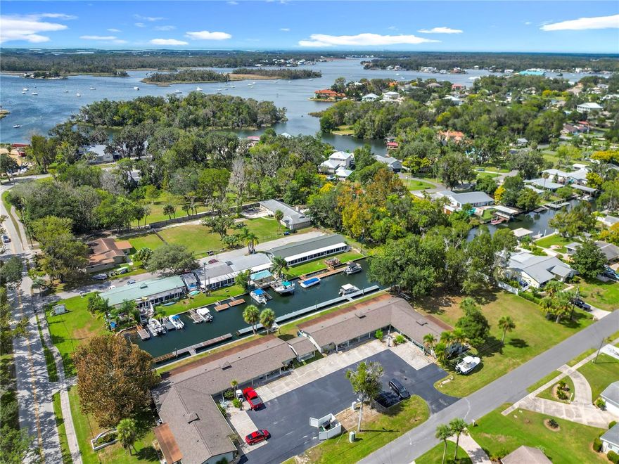 Welcome to effortless Florida living in this beautifully updated condo, ideally located in one of Crystal River’s most desirable golf cart–friendly communities. Whether you’re seeking a full-time residence, weekend retreat, seasonal escape, or income-producing vacation rental, this versatile property has it all.
Step right outside your back door to your brand-new dedicated dock and private boat launch—the perfect starting point for adventures to the world-famous Three Sisters Springs, Kings Bay, or the Gulf of Mexico. Enjoy peaceful water views directly from your living room and enclosed lanai.

Inside, modern updates provide both comfort and peace of mind. This condo features a completely NEW air conditioning system (condenser, air handler, and wiring), plus all new copper electrical wiring throughout. The newly remodeled kitchen shines with gorgeous Corian stone countertops, new cabinets, and a refrigerator. Tile flooring runs throughout, adding to the easy-care lifestyle.

The spacious master bedroom offers a huge closet, and the condo also includes access to a shared, secure storage room (centrally located between units 1–6 and 7–12 near the laundry area) for your convenience. Other highlights include new windows, a tinted glass-enclosed lanai, and assigned parking directly in front of the unit with excellent extended guest parking nearby.

With low HOA fees and affordable utilities, this property is as practical as it is charming. Come see why this condo is the perfect blend of modern updates, convenience, and relaxed waterfront living—all in the heart of Crystal River!