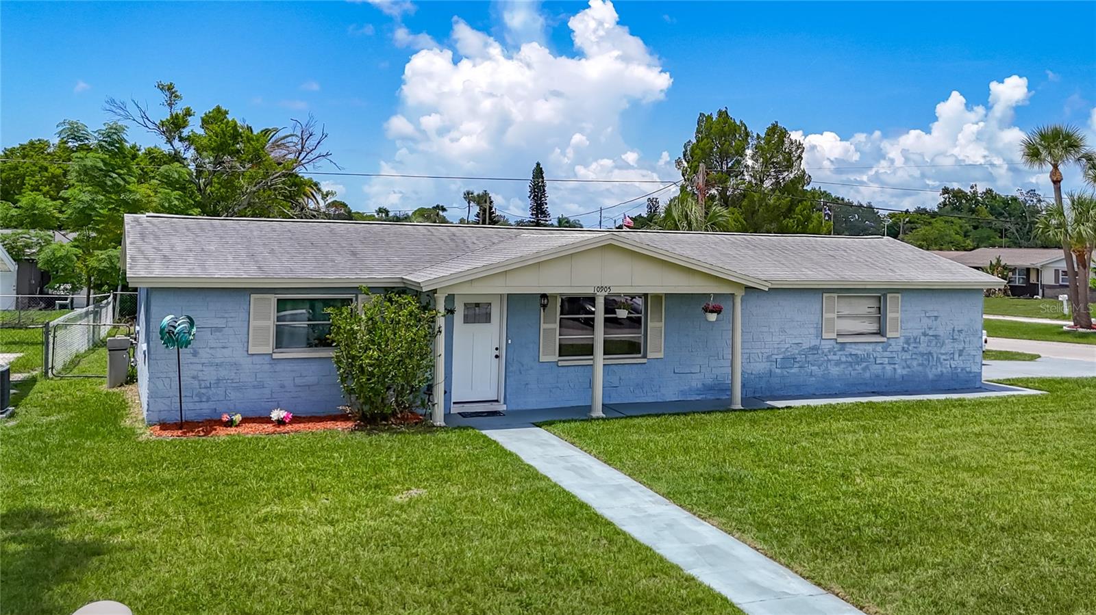 Ideal for First-Time Buyers, Downsizers, or Investors! This beautifully remodeled turnkey 2-bedroom, 2-bath block home with an oversized 2-car garage sits on a spacious corner lot and is ready for you to move right in. Step inside to discover bright, open living areas with an open-concept floor plan, perfect for both everyday living and entertaining. The updated kitchen boasts modern cabinetry, granite countertops, and a center island—ideal for gathering and cooking. Need a home office? A dedicated den/office space provides the perfect spot to work remotely or enjoy a quiet retreat. Both bathrooms have been refreshed with new vanities and low-flow toilets. You'll also love the new luxury vinyl plank flooring, newer A/C unit (2023), and a brand-new tankless water heater (2025). The roof was replaced in 2015, and the upgrades don’t stop there! The oversized garage offers ample room for storage or a potential workshop setup. Outside, the fully fenced huge backyard is ideal for pets, play, or extra parking—there's plenty of room for a boat, RV, or truck. With no HOA and low property taxes, this home is a rare find and an excellent value! Make sure you check out the 3D Virtual Walk and video!