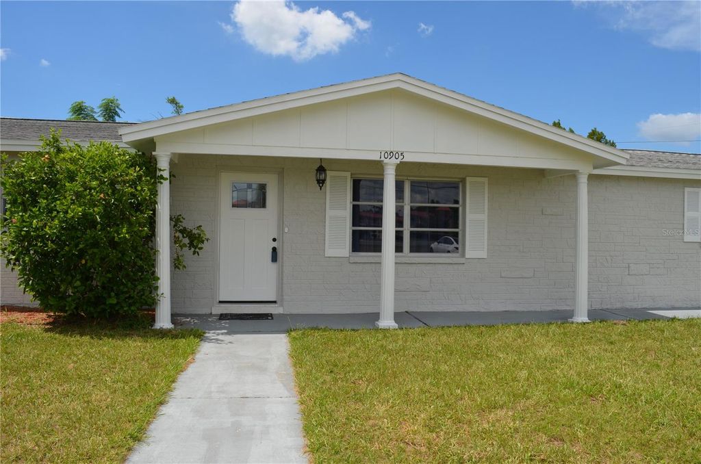 Photo of 10905 Scenic Drive, Port Richey, FL 34668 (MLS # W7877506)