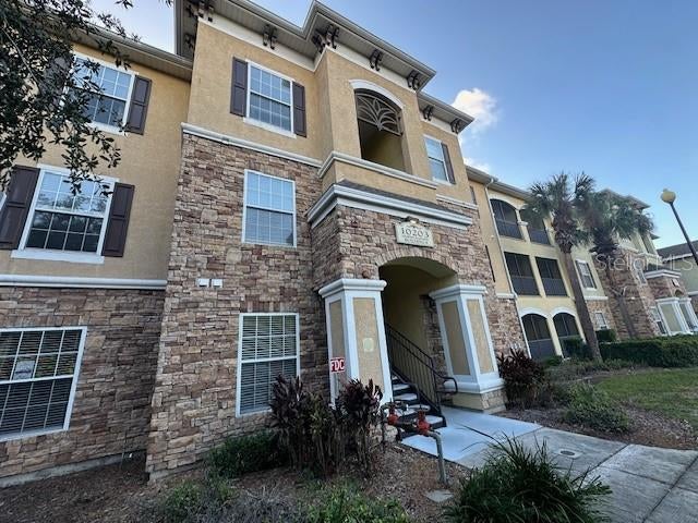 10203 COURTNEY PALMS BOULEVARD 202