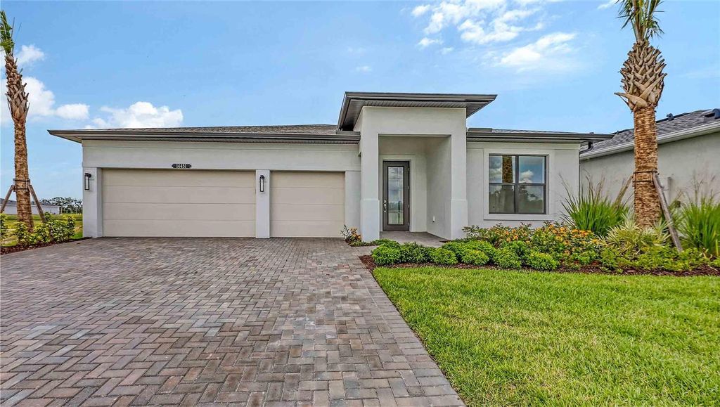 Photo of 14451 Coastal Woodland Lane, Parrish, FL 34219 (MLS # W7885054)