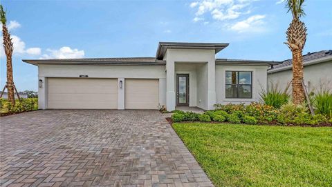 Photo of 14451 Coastal Woodland Lane, Parrish, FL 34219 (MLS # W7885054)