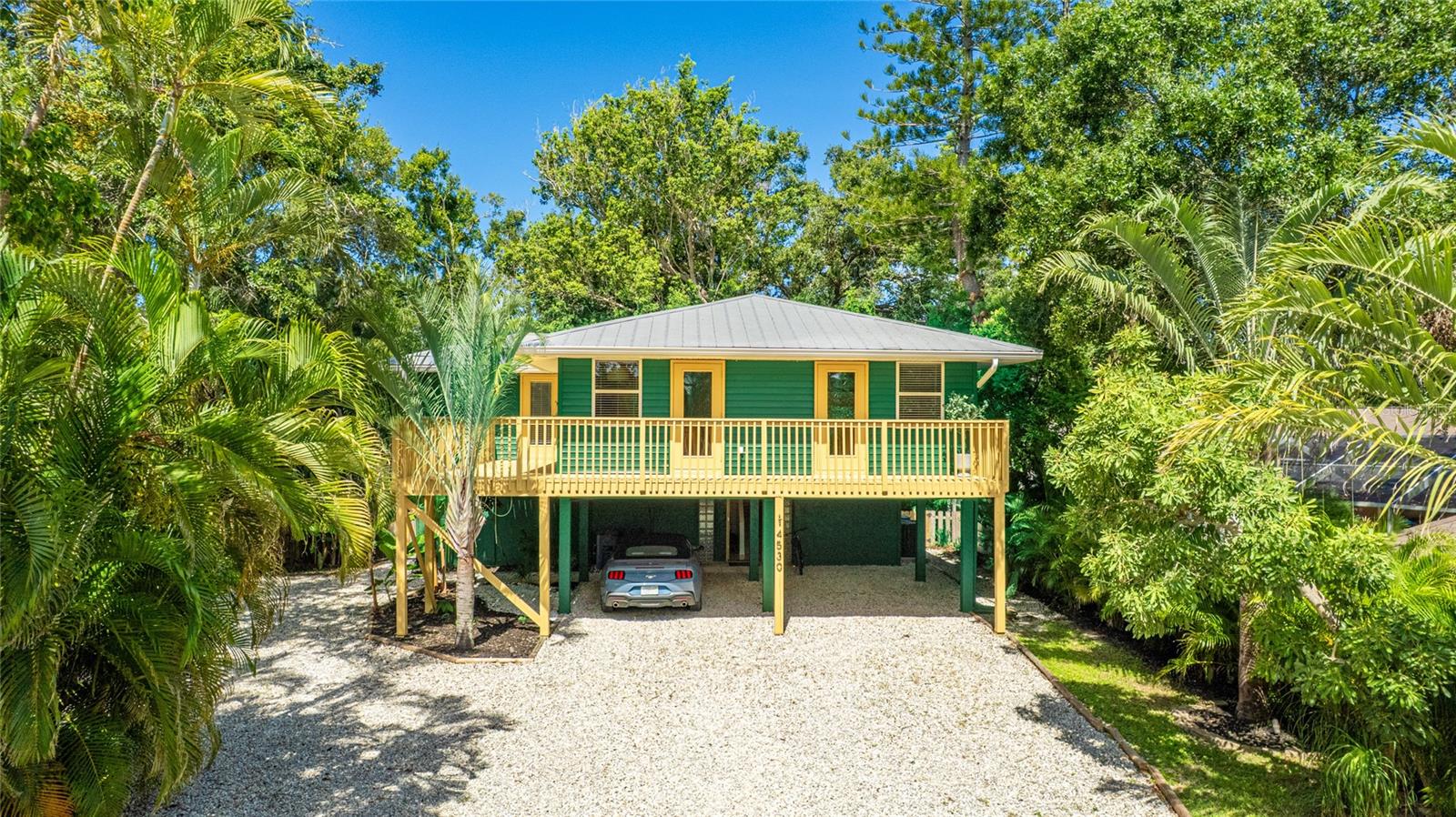 Welcome to The Palmshade Bungalow — your slice of paradise in the heart of Sarasota, just minutes from world-famous Siesta Key Beach. This elevated, fully furnished turnkey home blends style, comfort, privacy, and convenience in a quiet, friendly neighborhood right next to Bee Ridge Park.
Meticulously designed by a New Jersey–based interior designer, this 2-bedroom plus den (or 3rd bedroom), 3-bath beauty showcases a calming, earthy interior aesthetic, perfectly contrasted by its bold green-and-yellow exterior — a look that’s as unique as it is welcoming. Whether you’re dreaming of a full-time residence, seasonal getaway, or a savvy investment property, this home is ready to enjoy from day one — just bring your suitcase.
Inside, three versatile bedrooms offer flexibility for family, guests, or work-from-home needs. The refreshed interiors feature a warm, earthy palette and curated custom touches, including a French-abstract TV stand, a solid oak wood dining table, and all lightly used kitchenware. The layout even allows for future expansion, with space in the entryway to create a garage or additional sleeping area. In the backyard, a separate storage/tool room is ready to transform into a studio, art space, or keep as is.
You’ll be just minutes from Siesta Key’s powdery white sands and close to parks, walking trails, shopping, and top-rated schools. The surrounding area is still on the rise — making this not just a beautiful place to live, but also a smart investment.
Additional features include an elevated structure with a gravel driveway, generous covered parking and storage beneath the home, tropical landscaping with low-maintenance outdoor space, and thoughtful artistic touches throughout.
Whether you envision a fully furnished retreat or a ready-to-go Airbnb, The Palmshade Bungalow delivers charm, style, and endless possibilities — all in one perfect Sarasota package.