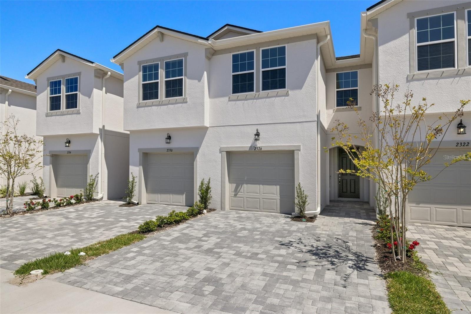 This sought-after floor plan provides 1,667 square feet of living space with 3 bedrooms, 2.5 baths, and a one-car garage. Located in a newer community featuring a pool, cabana, park, playground, and dog park, the home offers a bright open layout with a spacious kitchen that includes a breakfast bar, walk-in pantry, stylish Stone-colored cabinets, Sugar White quartz countertops, and stainless steel appliances. The kitchen flows seamlessly into the dining area and Great Room, with sliding glass doors leading to a covered lanai.
The second floor includes a versatile loft, ideal as a secondary living space, separating the owner’s suite from the two additional bedrooms and full bath. The tranquil owner’s suite features an en-suite bath and three generous walk-in closets, creating a private retreat.