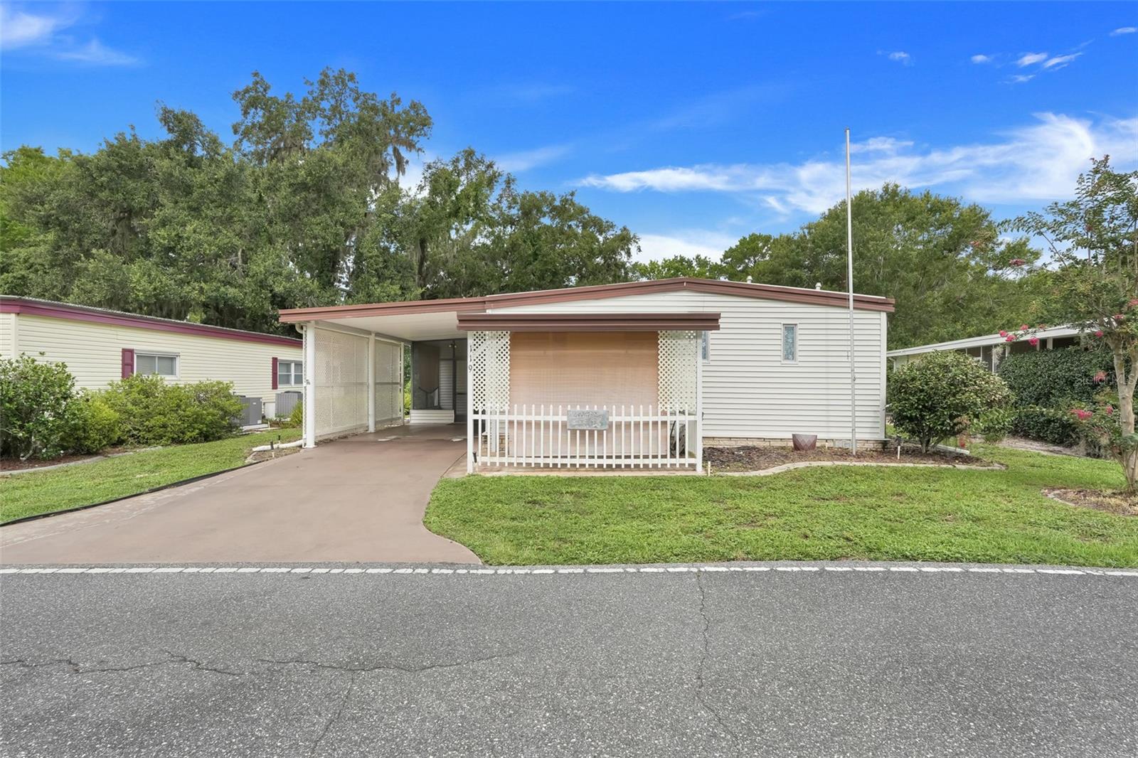 Waterfront Property! Location! Location! Location! This home is on the Canal. Sit outside on your beautiful back yard and enjoy the water and the boats traveling up and down the Canal. The yard is Huge. Big enough to hold fun get-togethers. Bad weather, come inside to your big Florida Room and continue to enjoy the scenery watching the boats go by.
This home boasts two bedrooms and two bathrooms. The primary Bedroom has its own ensuite. Large walk-in closet, plenty of storage.
An active 55+ Community, Hawthorne at Leesburg is a gated waterfront community. It has beautiful landscaping, fountains, gazebo's, Lake access, and walking paths. It has it all. The monthly maintenance fee includes water, sewer, lawn mowing, private emergency services for the residences. With more than 100 different activities with seating capacity for 550 in the community. This community enjoys craft rooms, card rooms, Billard rooms, fitness center, library, fine arts room, hospitality lounge and many more. Great Fishing. A geo-thermal pool and two enclosed therapeutic pools. Hawthorne comes with a private Marina, and 120 boat slips with access to Lake Harris, on the chain of lakes,