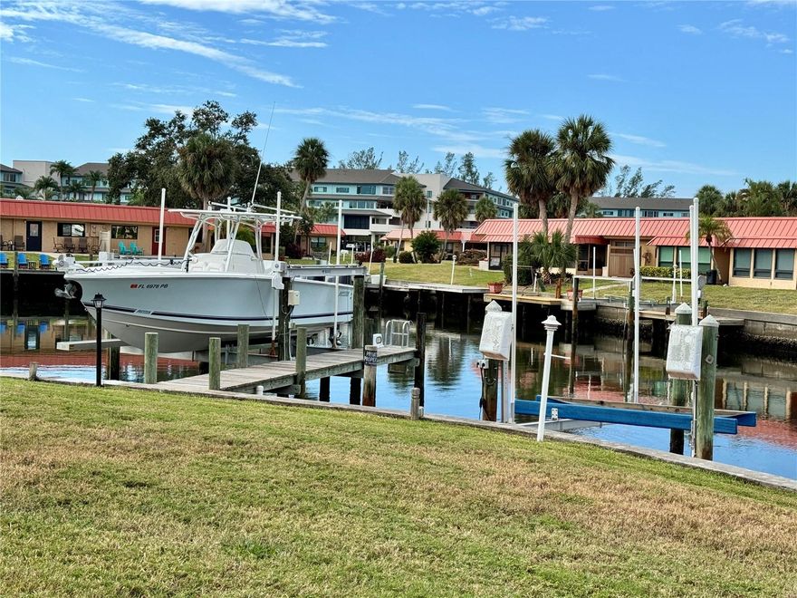 Looking for a waterfront property for your boat? Palma Sola Harbour is an active boating community with canals that provide a safe haven for your boat, as well as a home to Florida wildlife. Enjoy your morning coffee while watching the manatees, dolphins, pelicans, and spoonbills. Just 1 mile to Cortez Fishing Village, 2 miles from Anna Maria Island, so you don't have to worry about driving to the beach because you can ride your bike or walk! Part of the Complex overlooks Palma Sola Bay -- no bridges, so you can even have a sailboat. This corner unit Condo was remodeled in 2022, adding a 10x12 porch, walk-in shower, new ceilings, and luxury vinyl flooring. This unit has impact-resistant windows. It has not suffered any hurricane damage! You have your own composite dock, a 7,000 # Lift, with electrical for your boat. Flood Insurance is part of the Association dues. Active clubhouse with cards, bingo, parties. shuffleboard, pickleball, tennis, and putting green. Enjoy Florida by boat; it's the best way to experience Florida through its waterways! See this beautiful complex! The second Realtor is the owner.  Condo Docs, Rules and a wealth of info can be found at: https://pshcondos.com/.