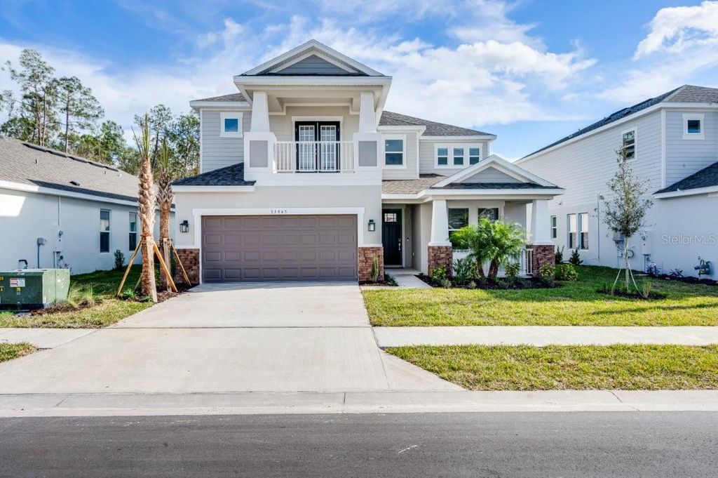 Photo of 33945 Landsman Loop, Wesley Chapel, FL 33543 (MLS # TB8341743)