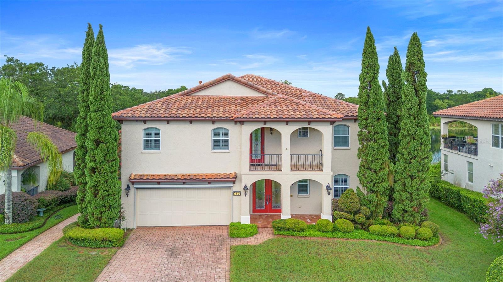 One or more photo(s) has been virtually staged. Discover refined Florida living in this beautifully designed 3-bedroom, 2.5-bathroom lakefront home located in the 55+ gated community of Lakes of DeLand. With 2,880 square feet of thoughtfully planned space, this residence sits directly on Lake Horseshoe and offers a peaceful view of a manicured retention pond across the front.
The layout was intentionally designed to highlight the lake. The first floor features a spacious family room with a large kitchenette, perfect for casual entertaining or extended guest stays, all overlooking the water. A comfortable master suite is also located on the first floor. Take the winding staircase or use the in-home elevator to reach the second floor, where the main living area opens up to breathtaking lake views.
The second floor includes the main kitchen, dining area, and living room, all centered around expansive windows that frame the lake. The primary bedroom, third bedroom, and laundry are also located upstairs. Step out onto the large covered patio—an ideal spot to relax or entertain while enjoying the peaceful water setting. The home features a whole house vacuum system.
The Lakes of DeLand community is known for its distinctive architecture, tile roofs, paver sidewalks and driveways, and its connection to nature. Residents enjoy access to three natural lakes, walking paths, and non-motorized boat access.
While the setting feels private and serene, you are just minutes from everything. The home is located less than two miles from the new Super Walmart, with more than 60 restaurants within a five-mile radius. Conveniently situated between Orlando and Daytona Beach, this home offers quick access to golf, beaches, and world-renowned attractions throughout Central Florida.