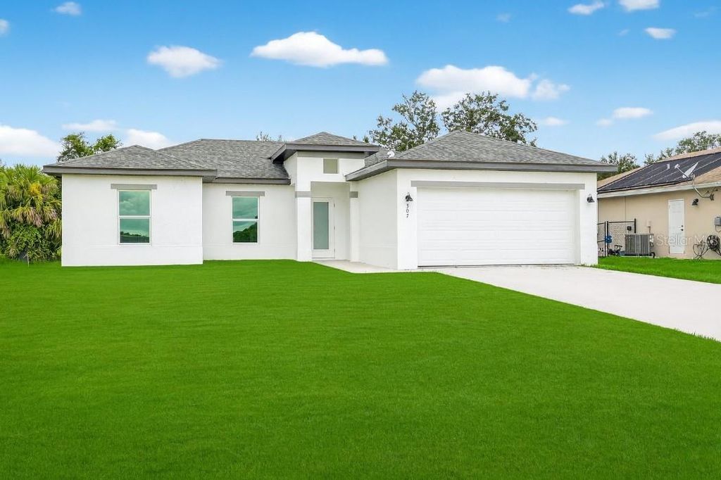 Photo of 625 Delmonico Street, Lehigh Acres, FL 33974 (MLS # O6350779)