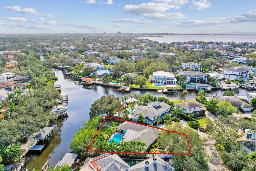 Discover this rare oversized .32-acre waterfront property located on a dead-end street in the heart of Sunset Park. This property offers an impressive 127 feet of water frontage on a deep-water canal that provides direct access to Tampa Bay. Embrace the best of both privacy and panoramic water views from this unique 14,000sq.ft. pie-shaped lot, where the expansive backyard and pool create an ideal outdoor retreat. The current home features four bedrooms, three bathrooms, a two-car garage, and two separate master bedrooms with en-suite baths. While the home experienced approximately 12 inches of water from Helene, it’s ready to be restored to its original charm. Alternatively, it’s the perfect canvas for building your new dream home in this sought-after neighborhood, known for its A-rated schools (Mabry, Coleman, and Plant) and unmatched convenience to everything Tampa Bay has to offer.