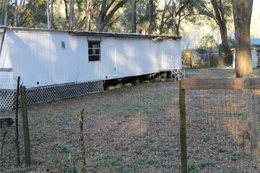 5845, 5825, 5865, & 5895 SE 31st Ave - Exceptional opportunity to acquire four income-producing parcels (sold together – cannot be separated) in rapidly growing Ocala. This offering is part of a larger 9-property investment portfolio and consists of a mix of manufactured/mobile homes, all tenant occupied with documented rental history and consistent cash flow. Immediate income is in place from day one, making this an ideal acquisition for investors seeking stabilized returns with long-term upside.

Each parcel is individually positioned yet assembled for maximum leverage and scale. The properties provide workforce housing in a market experiencing strong population growth, expanding logistics infrastructure, and continued economic diversification. Rental demand in this corridor remains resilient due to job creation and in-migration from higher-cost states.

Ocala’s expansion is supported by significant corporate investment. Major national operators such as FedEx and AutoZone have developed new warehouse and distribution facilities in the area, reinforcing employment stability and long-term rental demand. Additionally, the internationally recognized World Equestrian Center, the largest equestrian complex in the United States, drives year-round tourism, hospitality growth, and seasonal residency — all contributing to housing demand across price points.

Strategic Central Florida Location:
• Approx. 75 miles (±1 hr 15 min) to Orlando International Airport
• Approx. 1 hr 20 min to Daytona Beach (Atlantic Coast)
• Approx. 1 hr 30 min to Clearwater Beach (Gulf Coast)
• Convenient access to I-75 connecting Tampa, Orlando, and North Florida

This central positioning enhances tenant appeal while also strengthening long-term land value fundamentals.

Investment & Development Potential:
• Stabilized cash-flow asset
• Four-parcel assemblage increases redevelopment flexibility
• Attractive land-bank strategy in a growth corridor
• Opportunity to enhance rents or reposition over time (buyer to verify zoning and land-use possibilities)

As Marion County continues to attract industrial, logistics, and tourism-related development, assembled multi-parcel opportunities become increasingly scarce. This offering allows an investor to capture present income while maintaining optionality for future redevelopment or density optimization.

Properties of this scale — with occupancy in place and corporate-backed regional growth — represent a compelling blend of strong cash flow, appreciation potential, and strategic positioning in one of Central Florida’s fastest-evolving markets.

All parcels convey together. Serious investors and developers should evaluate this opportunity promptly.
REF: TB8478427 , TB8478451