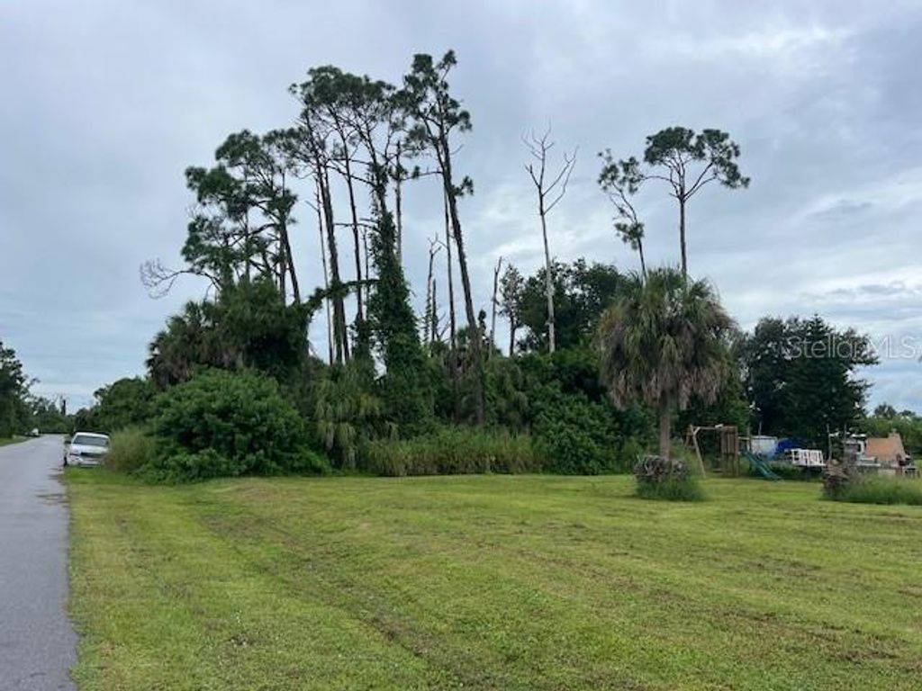 Photo of 15082 Community Avenue, Port Charlotte, FL 33953 (MLS # A4663356)