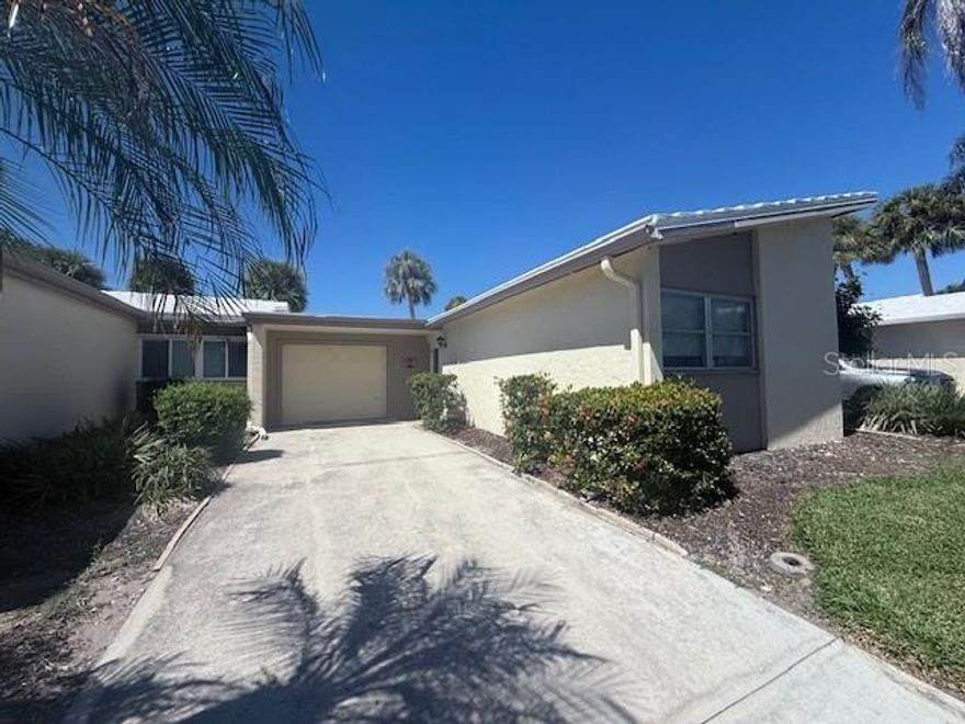 Available for season March and April 2026! This 2 bedroom 2 bath villa with easy ground floor entry features tile flooring in the main living areas and plush new carpeting in the bedrooms. The stylish galley kitchen has been fully updated with custom white cabinetry, granite countertops and backsplash, recessed lighting, and brand-new GE appliances, perfect for preparing meals after a day at the beach.
Enjoy seamless indoor-outdoor living as the living and dining areas open to a private open-air patio through two sets of French doors. Both bathrooms have been tastefully renovated with modern vanities, granite countertops, and upgraded fixtures. The spacious primary suite offers a King size bed and luxurious ensuite bath with dual sinks, a separate vanity area, a walk-in closet, and linen storage.
Additional features include a new full-sized washer & dryer, ample storage throughout, walk-in shower, and a guest bedroom with a queen size bed. Located just steps from the clubhouse pool and a short walk to 800 feet of private quartz sand beach on the Gulf, along with a second beachside pool. Whispering Sands also offers canoe/kayak storage, shuffleboard, on-site management & maintenance, security, and a clubhouse currently being renovated. Just minutes from Siesta Key Village’s shops and restaurants, this villa offers the perfect balance of relaxation and convenience. This is great for a seasonal getaway!