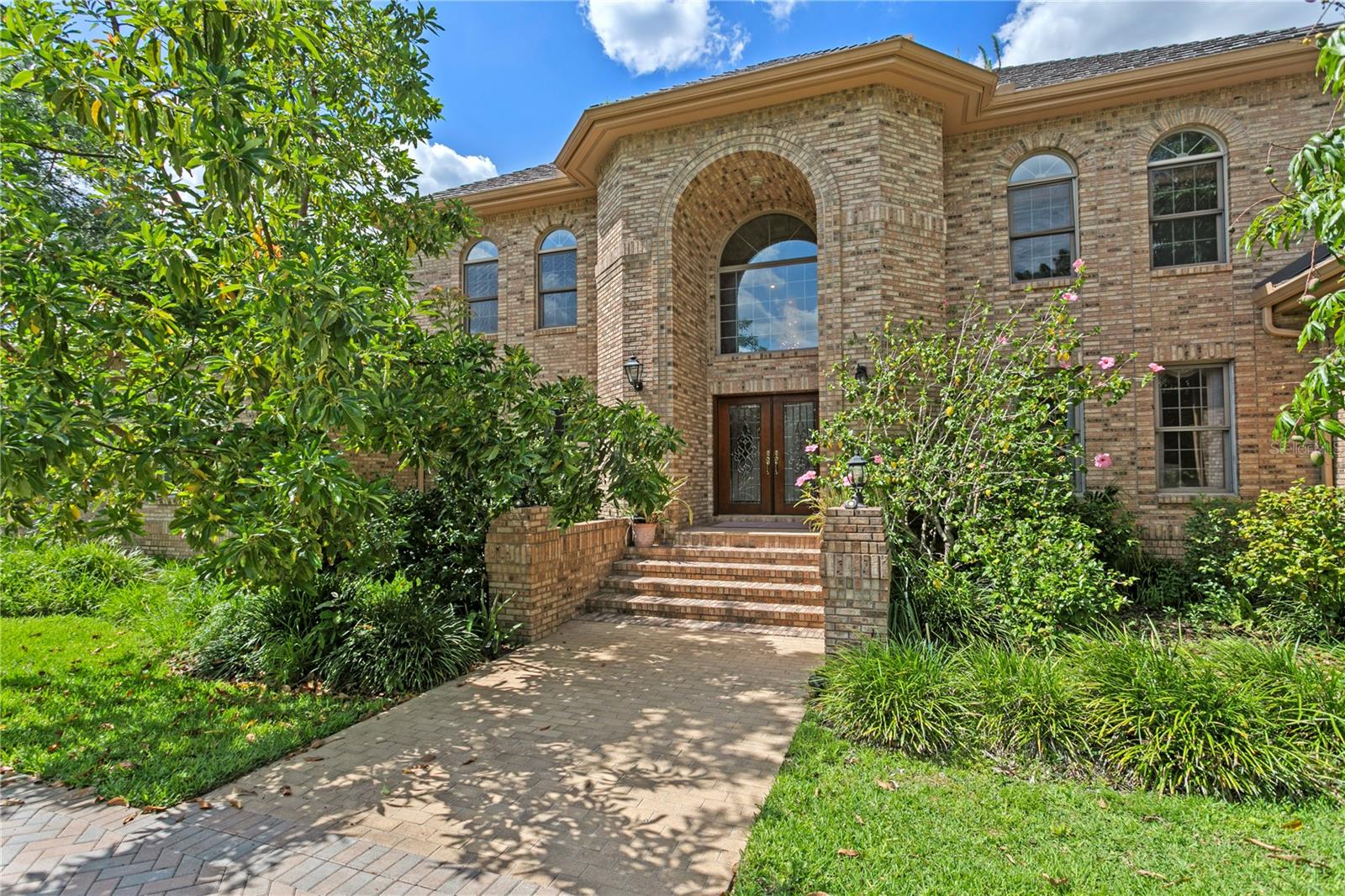 Under contract-accepting backup offers. STATELY TWO-STORY TRADITIONAL BRICK GOLF COURSE HOME, LOCATED IN AVILA, TAMPA BAY'S PREMIER GUARD GATED GOLF AND COUNTRY CLUB COMMUNITY. CUSTOM BUILT BY RALPH EUBANKS, IN 1992, THIS WONDERFUL EXECUTIVE HOME FEATURES 4 BEDROOMS, 4-1/2 BATHS, FORMAL OFFICE, AND UPSTAIRS LOFT. UPON ENTRY YOU ARE GREETED BY A TWO-STORY FOYER HAVING MARBLE FLOORING, AND A SWEEPING STAIRCASE, SEPARATING THE FORMAL LIVING ROOM AND DINING ROOMS. AS YOU STROLL THROUGH YOU WILL ENTER THE SPACIOUS FAMILY ROOM WITH FIREPLACE, LARGE KITCHEN NEARBY, WITH BREAKFAST ROOM, POWDER ROOM, WITH A LARGE FREEFORM POOL AND THE 7TH GREEN OF THE GOLF COURSE BEYOND. THE DOWNSTAIRS FORMAL OFFICE, ALSO HAS A GUEST SUITE NEARBY WITH BATH, THIS AREA CAN EASILY BE CONVERTED TO A DOWNSTAIRS OWNER’S RETREAT! UPSTAIRS DISCOVER A SPACIOUS LOFT, THE MASTER BEDROOM, ADDITIONALLY TWO MORE BEDROOMS, ALL HAVING THEIR PRIVATE BATHROOMS, WALK-IN CLOSETS, BALCONIES FOR GOLF COURSE AND POND VIEWS. SOLID BRICK CONSTRUCTION, SPACIOUS ROOMS THROUGHOUT, IMPRESSIVE DENTAL MOLDINGS INSIDE, CENTRAL VACUUM, MATURE LANDSCAPING, INCLUDING EXOTIC PLANTS, AND LAKE VIEW ON ONE SIDE, METAL ROOF! FLOOD ZONE X, 4,891 S.F..... GREAT OPPORTUNITY!!