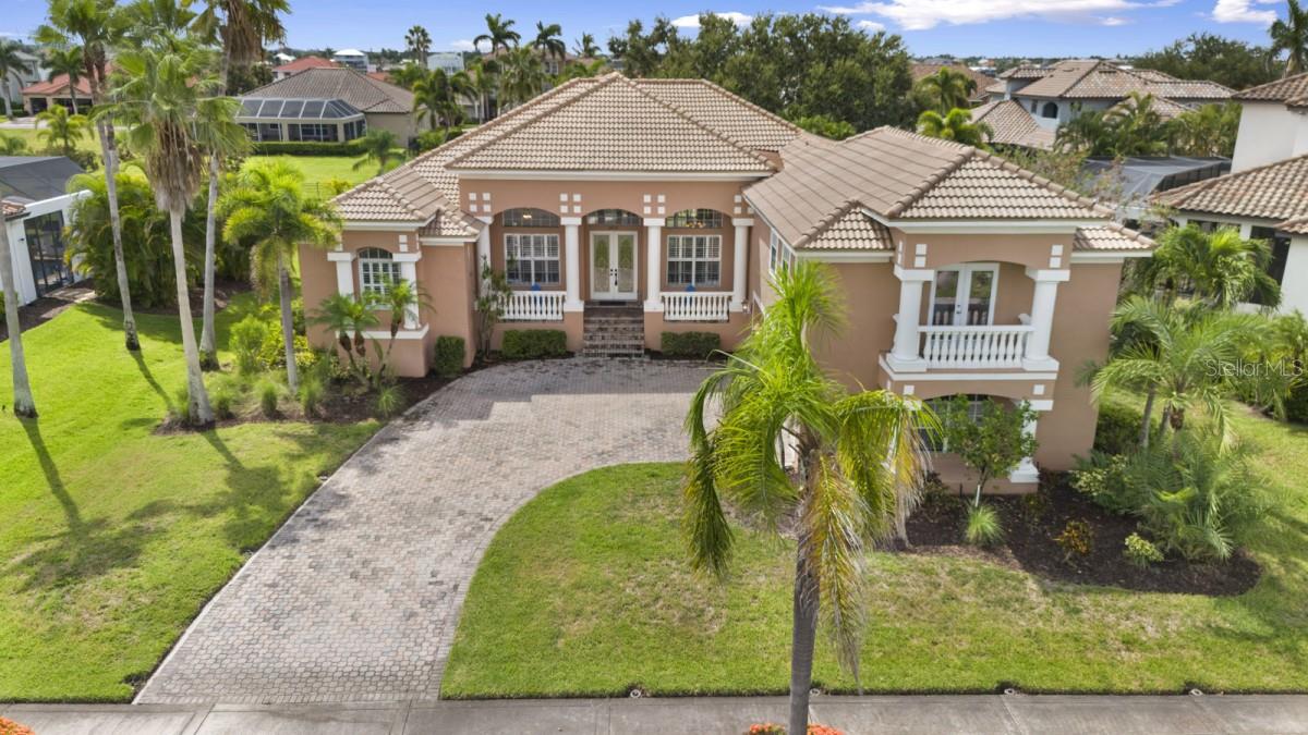 From the moment you drive through the 24 hr. manned security gate you'll know you have entered a special piece of paradise in an upscale community that sits directly on Tampa Bay. You will soon want to call this home. Once you pull up to this beautiful, 3,638 sq. ft., five (5) bedroom, four (4) full bathroom, and three (3) car garage pool home (5/4/3), you will notice the fresh new landscaping, great curb appeal, as well as the brand new tiled roof (Completed on 15 JUL 25). As you enter the home through the double french doors, you will be immediately impressed with the bright foyer, high ceiling and grand, yet warm and welcoming entry. This home is truly move in ready with its, newer Main AC unit (Trane, replaced on 04 JUN 21), Custom Aluminum AC Brackets / stands that will never rust or rot (replaced on 04 JUN 21), new water softener (MAY 25) recently resurfaced pool and salt water conversion (29 JUN 21), brand new carpeting throughout the entire upstairs (07 JUL 25), all new flooring through the entire downstairs, a freshly remodeled Master Bathroom (DEC 23) and Plantation shutters through the majority of the home and all are new with the exception of the ones in the two front windows.
Downstairs, the home offers you the extremely large master bedroom and master bathroom complete with largen garden tub, walk-in shower, dual vanities and large walk-in closet. The master also offers its own set of sliding doors to a private sitting area on the large lanai with pool.