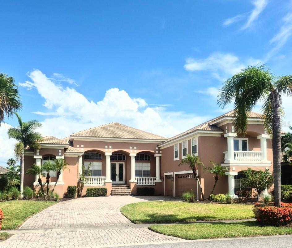 From the moment you drive through the 24 hr. manned security gate you'll know you have entered a special piece of paradise in an upscale community that sits directly on Tampa Bay. You will soon want to call this home. Once you pull up to this beautiful, 3,638 sq. ft., five (5) bedroom, four (4) full bathroom, and three (3) car garage pool home (5/4/3), you will notice the fresh new landscaping, great curb appeal, as well as the brand new tiled roof (Completed on 15 JUL 25). As you enter the home through the double french doors, you will be immediately impressed with the bright foyer, high ceiling and grand, yet warm and welcoming entry. This home is truly move in ready with its, newer Main AC unit (Trane, replaced on 04 JUN 21), Custom Aluminum AC Brackets / stands that will never rust or rot (replaced on 04 JUN 21), new water softener (MAY 25) recently resurfaced pool and salt water conversion (29 JUN 21), brand new carpeting throughout the entire upstairs (07 JUL 25), all new flooring through the entire downstairs, a freshly remodeled Master Bathroom (DEC 23) and Plantation shutters through the majority of the home and all are new with the exception of the ones in the two front windows.
Downstairs, the home offers you the extremely large master bedroom and master bathroom complete with largen garden tub, walk-in shower, dual vanities and large walk-in closet. The master also offers its own set of sliding doors to a private sitting area on the large lanai with pool.