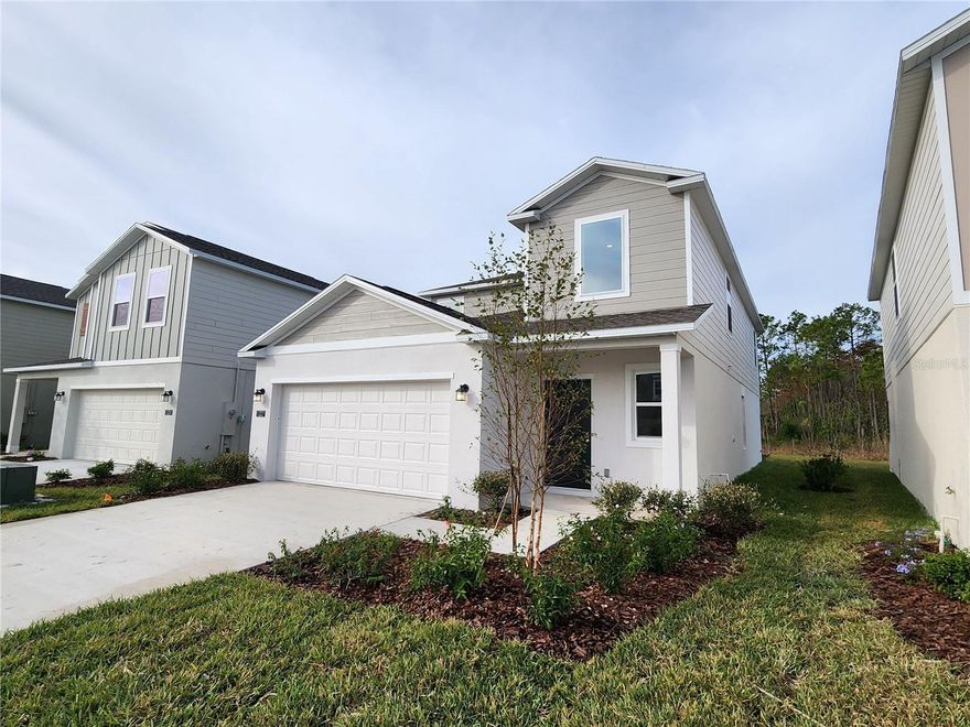 Come see this incredible Brand New 5 bedroom, 2.5 bath home near the famous LGPA in Daytona Beach. This home has model upgrades with wall decorated features in several rooms (in process). This Columbia floor plan from Lennar homes is highly desirable with plenty of living space on the first floor including the Primary Suite. Tall ceilings and floor Tile throughout the living room, kitchen, and baths. Several walls were carefully selected to include decorative molding and chair rail along with custom painting (in process.) The homes main floor is an open floor plan with living room, dining area, and kitchen together, great for community with the kitchen is the middle focal point. The kitchen has Tall white wall cabinets with light cream colored stone counters accented with all Stainless-steel appliances. The walk-in pantry is huge and right next to the island with breakfast bar overlooking the dining area and living room. The living room has a ceiling fan and a slider leading to the back patio. The large primary bedroom, also facing the back, has a ceiling fan, and a large bathroom with dual sinks on stone counters, separate toilet closet, large walk-in shower and huge closet. Pass by the half bath to go upstairs to bedrooms 2-5. At the top of the stairs is a large loft with chair rail and tastefully painted walls and ready for many multi uses. Two of the bedrooms have larger walk-in closets and painted accent walls. The hall bath has dual sinks and separated bath and toilet area for high efficiency use. The laundry room is next to the two-car garage. The Preserve at LGPA community has a community pool, park, and playground along several wetland preserves throughout the community and about 2 miles between LGPA International and I4, and a short jump to 95 with the Tanger Outlet Mall and all the other shops and restaurants, Daytona Speedway, Daytona Beach International Airport, and a few miles away to the world-famous beach. Please email for more info or to set up a showing. all information is deemed reliable but not guaranteed
