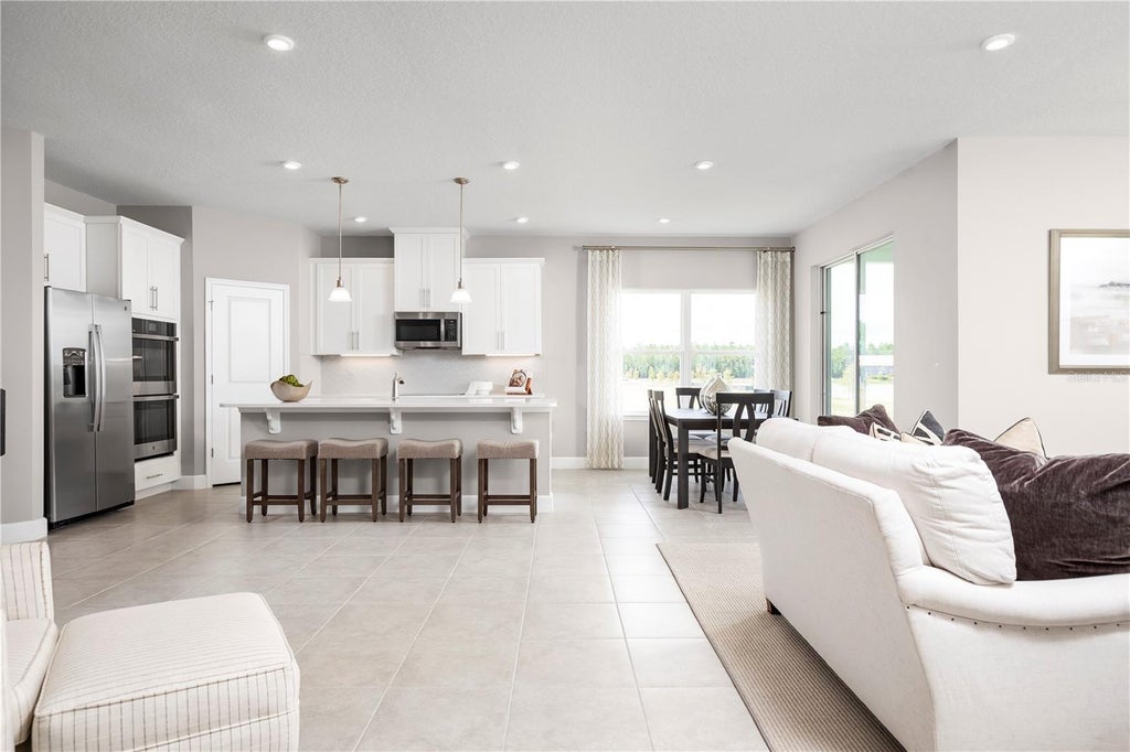 Photo of 454 Hammock Oaks Boulevard, Lady Lake, FL 32159 (MLS # W7889313)