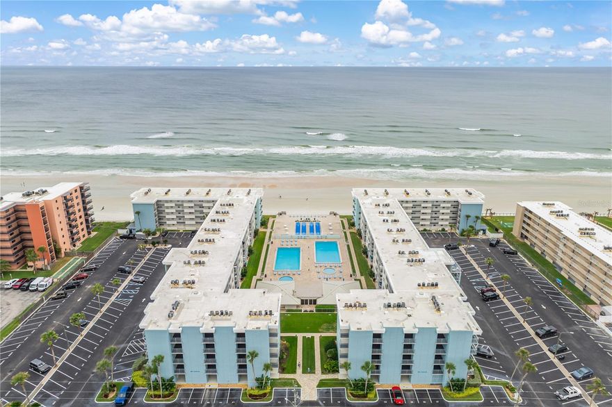 Imagine waking up to watch the sunrise cast a warm light across your private balcony and taking in the soft ocean breeze as you stroll along a no-drive shoreline. This is everyday living at Sea Coast Gardens, one of New Smyrna Beach’s most beloved oceanfront communities. This thoughtfully updated condo captures the relaxed elegance of coastal Florida living at a price you can't ignore.

Inside, this turnkey unit feels bright, modern, and welcoming with NEW LVP floors, NEW granite kitchen countertops, NEW HVAC and NEW Water Heater systems to provide year-round comfort and peace of mind, whether you’re here full-time or enjoying it as a seasonal retreat.

Sea Coast Gardens is known for its impeccable grounds, resort-style amenities, and exceptional walkability. Spend your days lounging beside two large pools with kiddie pools for the little ones, grilling with friends, or taking advantage of direct access to New Smyrna’s pristine, no-drive beach. You and your guests will love the large beach deck, clubhouse, and shuffleboard courts. Evenings here are also magical! Dine on your balcony while listening to the waves roll in, and catch the occasional rocket soar into the sky from the nearby Space Coast!

With short-term rentals permitted, HOA financials in good standing, and up-to-date Milestone Inspection and Reserve Study, this condo is a rare blend of coastal lifestyle and investment opportunity. Whether you're building your rental portfolio, seeking a winter getaway, or dreaming of a relaxed retirement spot by the ocean, this property offers the simplicity, beauty, and flexibility you’ve been searching for.

Just minutes from the vibrant boutiques and dining of Flagler Avenue, 27th Ave Beachfront Park, the infamous JB’s Fish Camp, and Canaveral National Seashore just down the road, you’re connected to the heart of NSB’s laid-back coastal culture. This is your chance to own a piece of Florida’s most cherished beachfront community.