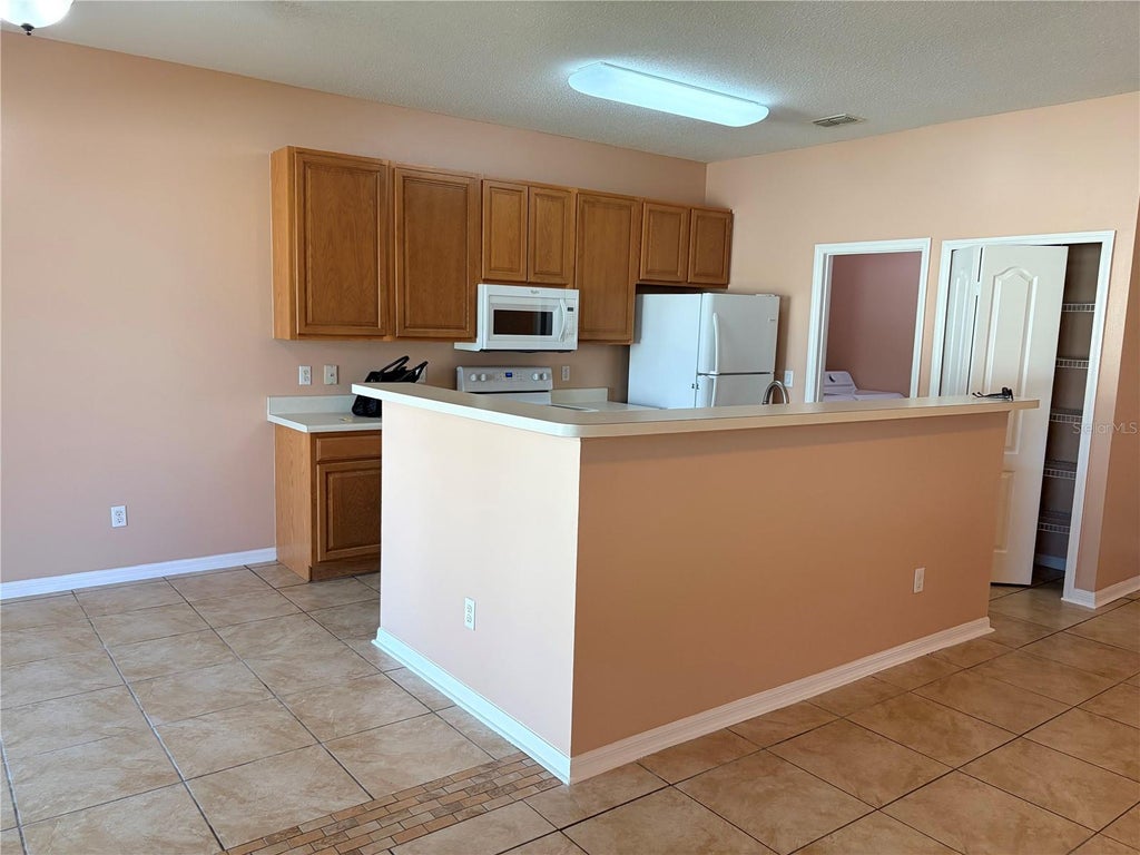 Photo of 619 Kermarah Avenue, Haines City, FL 33844 (MLS # OM731883)