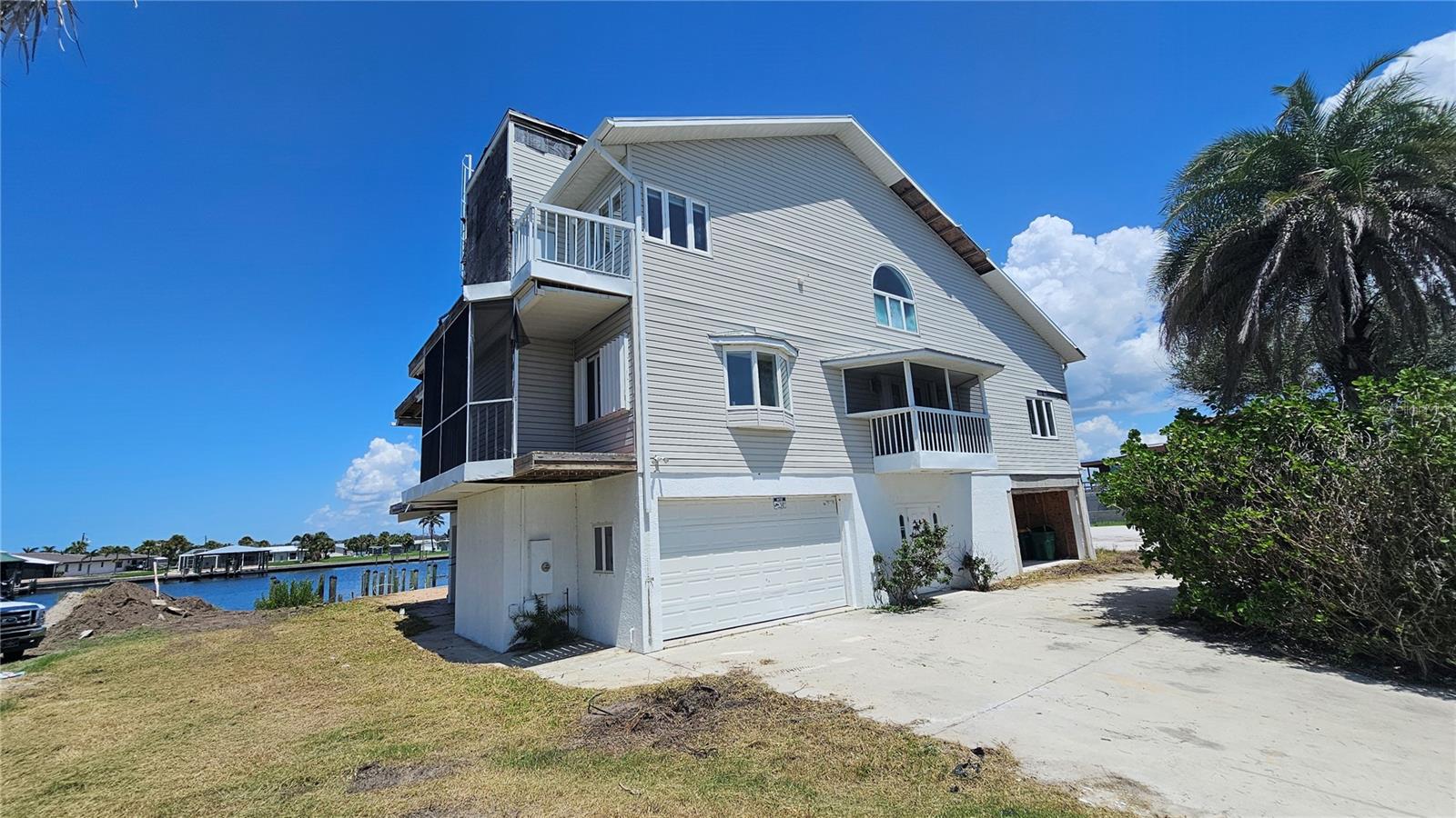 Calling all visionaries and waterfront dreamers! This exceptional custom-built home nestled on widest sailboat water canal in the Englewood offers a rare opportunity to create your own customized Coastal retreat. It boasts a superior location and breathtaking 180-degree views of Stump Pass and Lemon Bay. It is minutes to the Gulf with no bridges. Imagine waking up to vibrant, blissful sunrises and winding down to outrageous sunsets. With some imagination and restoration, this home could be transformed into sophisticated seaside showplace.
the first floor flooded, will need some windows, doors, dock repair and remodeling to update.
The property has something to Hurricane shutters and windows, an elevator. It contains a Fourth bedrooms, four baths, a library, an office, an expansive kitchen, spacious dining room, double living room, family room, and remarkable outdoor amenities including six boat docks and hot tub. Notably, this property was previously sold in 2021 for $2.5 million before it was remodeling, underscoring its value and appeal.
Several new homew being built on street including two next door. Dont miss this opportunity as thus deal will be gone if you dont act fast!