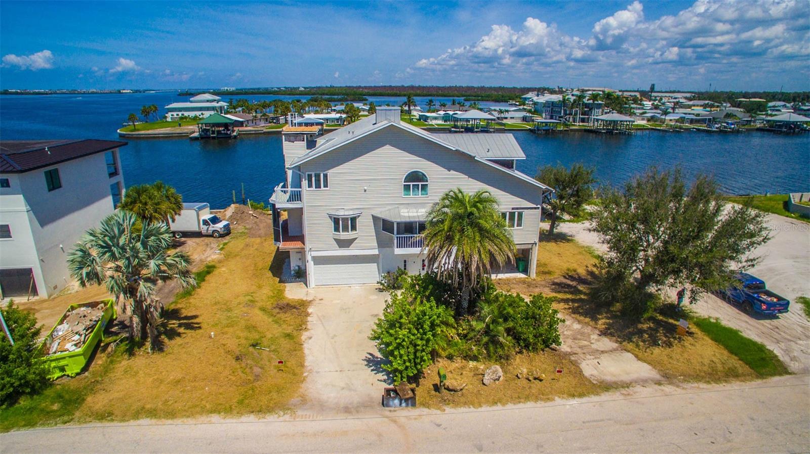 Calling all visionaries and waterfront dreamers! This exceptional custom-built home nestled on widest sailboat water canal in the Englewood offers a rare opportunity to create your own customized Coastal retreat. It boasts a superior location and breathtaking 180-degree views of Stump Pass and Lemon Bay. It is minutes to the Gulf with no bridges. Imagine waking up to vibrant, blissful sunrises and winding down to outrageous sunsets. With some imagination and restoration, this home could be transformed into sophisticated seaside showplace.
the first floor flooded, will need some windows, doors, dock repair and remodeling to update.
The property has something to Hurricane shutters and windows, an elevator. It contains a Fourth bedrooms, four baths, a library, an office, an expansive kitchen, spacious dining room, double living room, family room, and remarkable outdoor amenities including six boat docks and hot tub. Notably, this property was previously sold in 2021 for $2.5 million before it was remodeling, underscoring its value and appeal.
Several new homew being built on street including two next door. Dont miss this opportunity as thus deal will be gone if you dont act fast!
