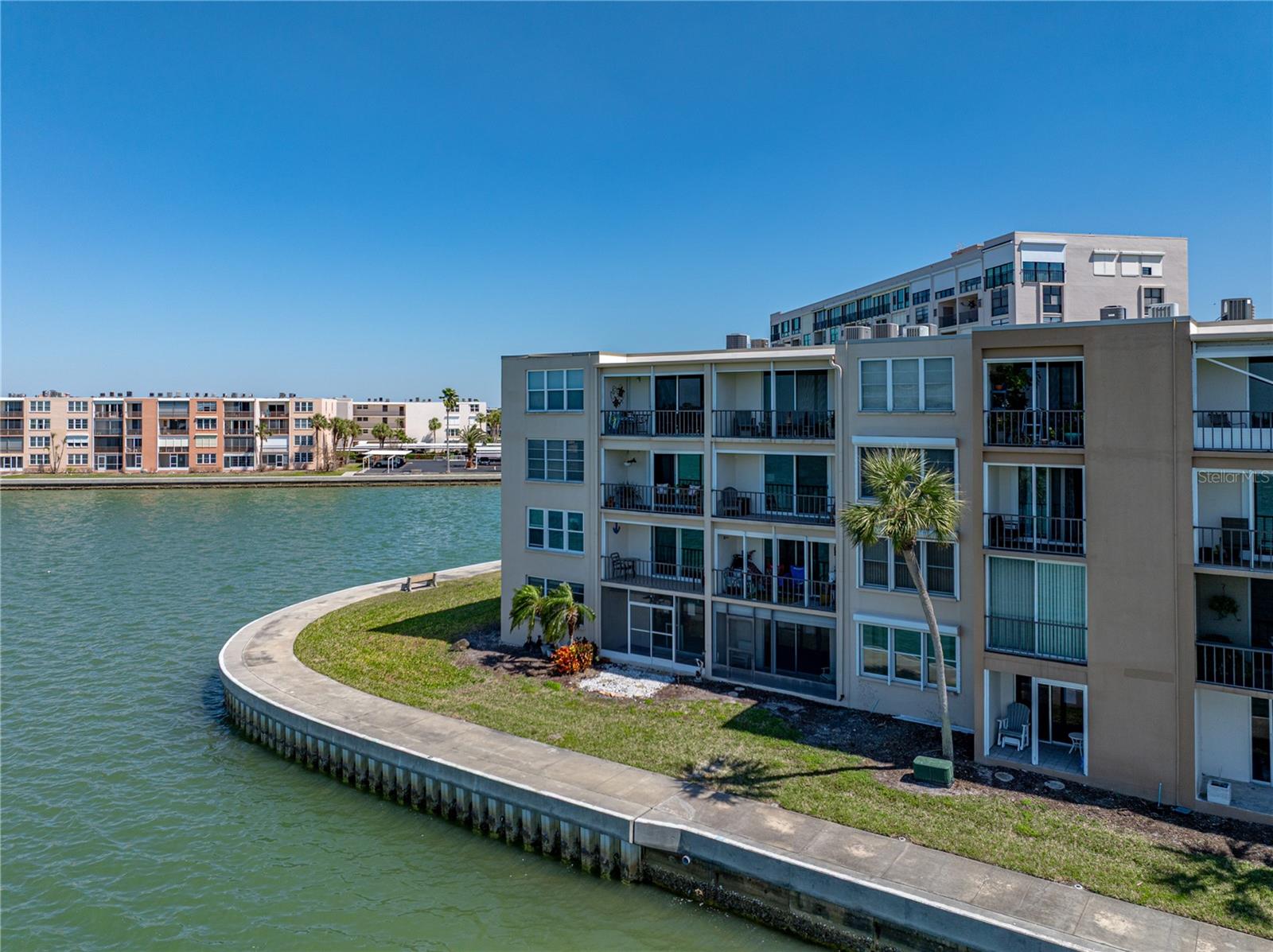 Big Price Reduction! Great Opportunity for Discerning Buyer! Beautiful two-bedroom, two-bathroom condominium offers approximately 1,170 square feet of living space in the desirable Yorktown Building. Showcasing a wide-open floor plan! The unit features an updated kitchen with granite countertops and stainless steel appliances. The incredible water views from the private balcony, provide the perfect setting to enjoy stunning sunsets and observe the playful dolphins and manatees.
All windows in the home are impact-resistant, enhancing the property's safety and resilience. The third-floor corner location offers additional privacy and natural light. Residents of the Bay Island community have access to a wealth of amenities, including tennis courts, pickleball courts, and on-site fitness centers, all within a short distance to St. Pete Beach. The property's proximity to Tampa International Airport makes it an ideal choice for those seeking convenient access to regional and national travel options.