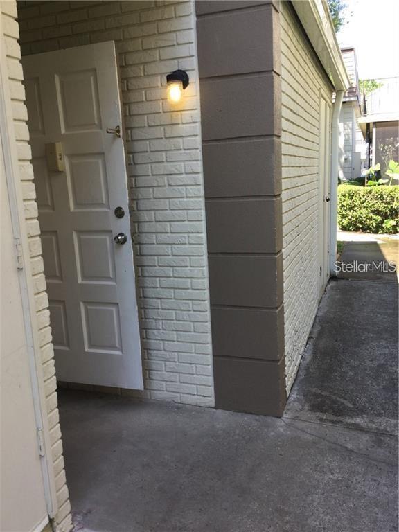 First floor, one bedroom, 1-1/2 bath condo in Village Square Condo community with community pool, tennis courts, and custom clubhouse and external laundry facility. Spacious Great room with a separate Dining area, foyer, and exterior open rear porch overlooking the common garden area. UNIT DOES NOT HAVE INDOOR LAUNDRY/UTILITY ROOM. Centrally located, walking distance to the local Lynx bus stop, and just 15 minutes from Orlando International Airport and major state roads SR408 and SR528. The pool and laundry facility are close to the unit.