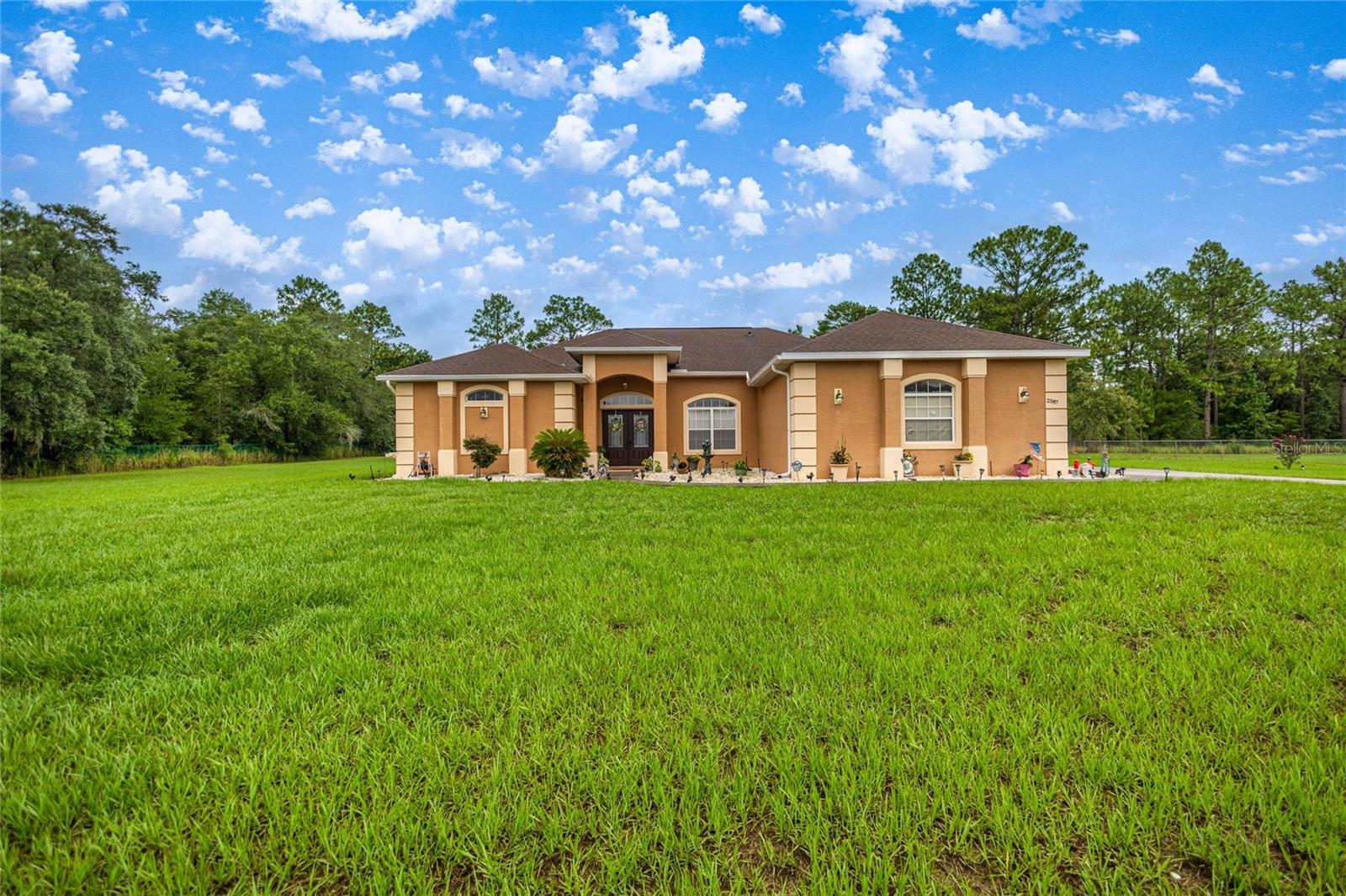 Beautifully maintained 4 bedroom, 3 bathroom pool home on over an acre in the desirable Pine Ridge community. This spacious residence features an open concept kitchen, dining area, living room and a separate family room- perfect for entertaining. The private owner's suite offers a comfortable retreat with a soaking tub, separate shower and double sink vanity. Enjoy the convenience of three walk in closets, multiple additional closets and a 3 car garage. The backyard is a private oasis with a sparkling pool and ample outdoor space. A rare find in a peaceful, sought-after neighborhood.