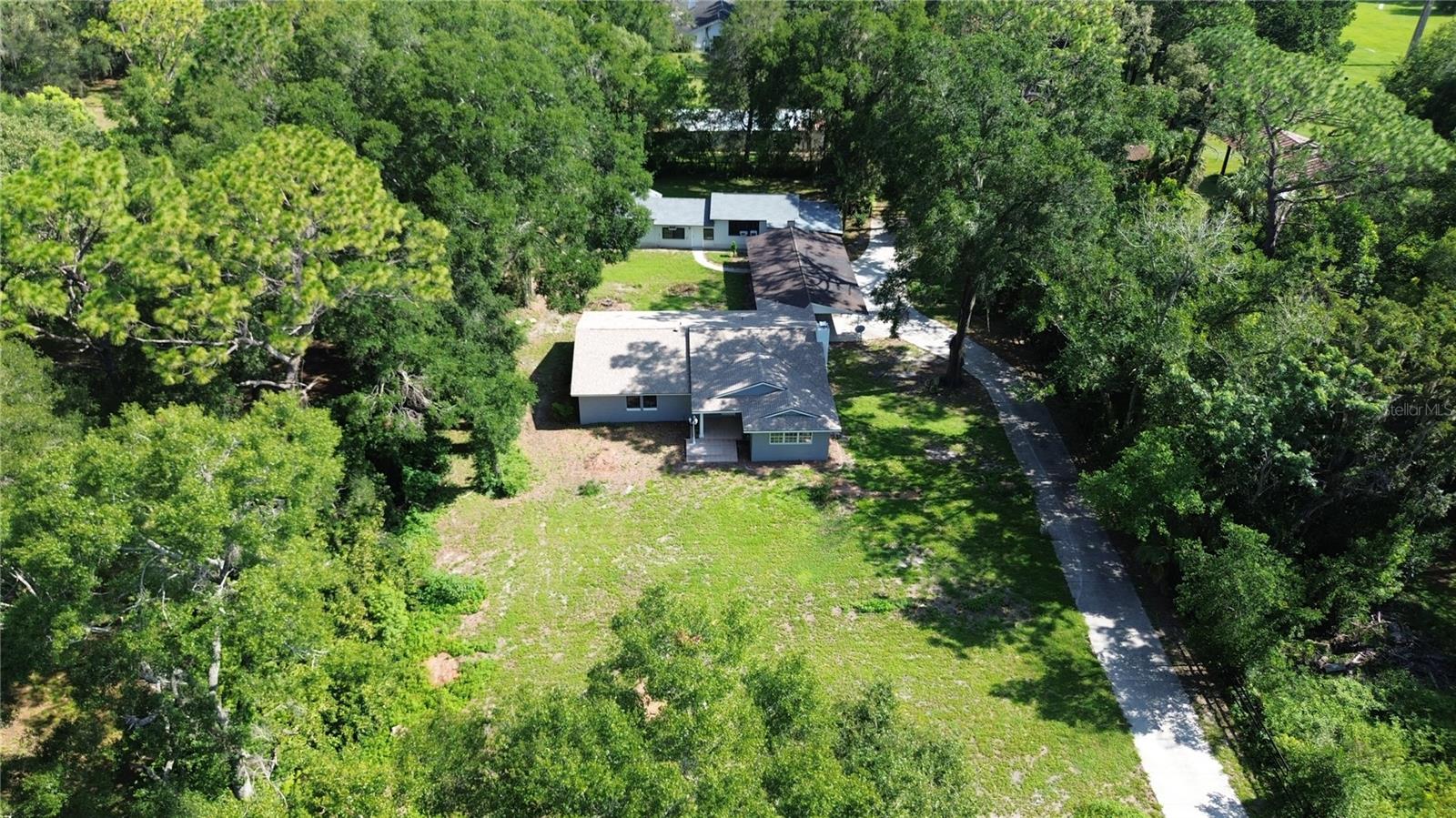 A truly RARE OPPORTUNITY TO RENT TWO HOMES ON ONE PROPERTY!—YOU CAN RENT ONE HOME OR BOTH TOGETHER!! This beautiful dual residence estate sits on just over an acre of private land down a quiet street in a peaceful and convenient part of Ocala. Perfect for families or anyone seeking extra space, it combines comfort, accessibility, and a welcoming community atmosphere. The smaller home includes 2 spacious bedrooms, 2 bathrooms. Both homes share a parking area that fits up to 4 vehicles, and the expansive lot provides plenty of outdoor space for relaxation, entertaining, or enjoying the Florida lifestyle. Prime location, Families who want extra space, Minutes to shopping, dining, and entertainment. Schedule your showing today!