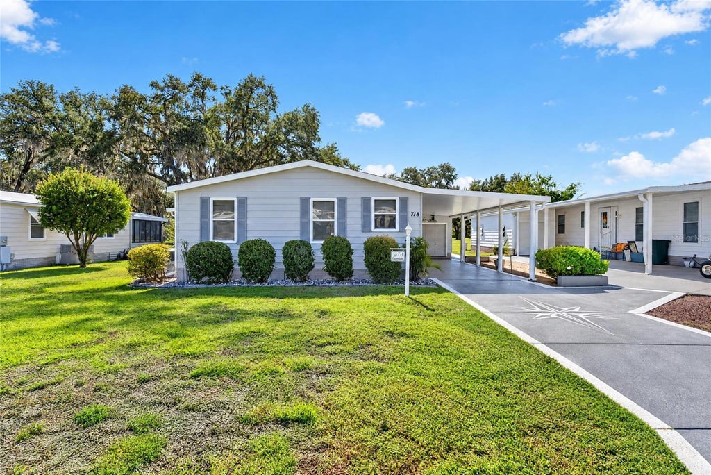 Photo of 718 Orchid Street, Lady Lake, FL 32159 (MLS # G5119205)