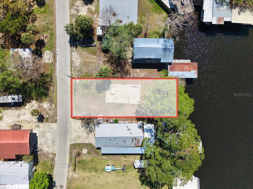Perfect lot located on the largest deep water canal in the town of Suwannee Florida known as Lake Holiday with direct access to the Suwannee River and less than a mile to the Gulf of Mexico, and gorgeous sunsets. Coming in at .13 acres with a seawall and concrete pad in place. Easy access to connect to city utilities water, sewer and power, this is the perfect set up for your new coastal getaway! Whether bringing the camper or building your coastal retreat this property offers everything you need. Call today for more information on this property or take a stroll out to see the Charming town of Suwannee, a secluded and private coastal community and fisherman's paradise.