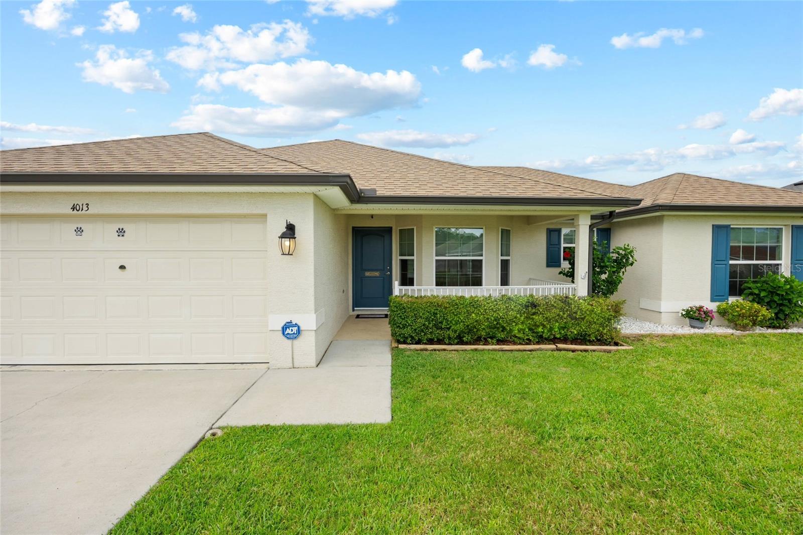Welcome to this charming three-bedroom, two-bathroom home located in the desirable Cobblestone North, perfectly situated between The Villages and Ocala, and just minutes from the scenic Santos trails. Built in 2018, this lovely residence boasts a master bedroom adorned with elegant trey ceilings and an en-suite bathroom featuring double sinks for added convenience. The inviting open floor plan showcases upgraded appliances in the spacious kitchen, making it a delight for both cooking and entertaining. Step outside to discover a stunning 28x12 heated inground pool complete with a serene waterfall and a secure pool enclosure, perfect for year-round enjoyment. The fenced backyard not only ensures privacy with no rear neighbors but is also beautifully maintained with an efficient irrigation system that keeps the landscape lush and green throughout the seasons. This home is an idyllic retreat for anyone looking for comfort and convenience in a vibrant community. Schedule your private showing today!