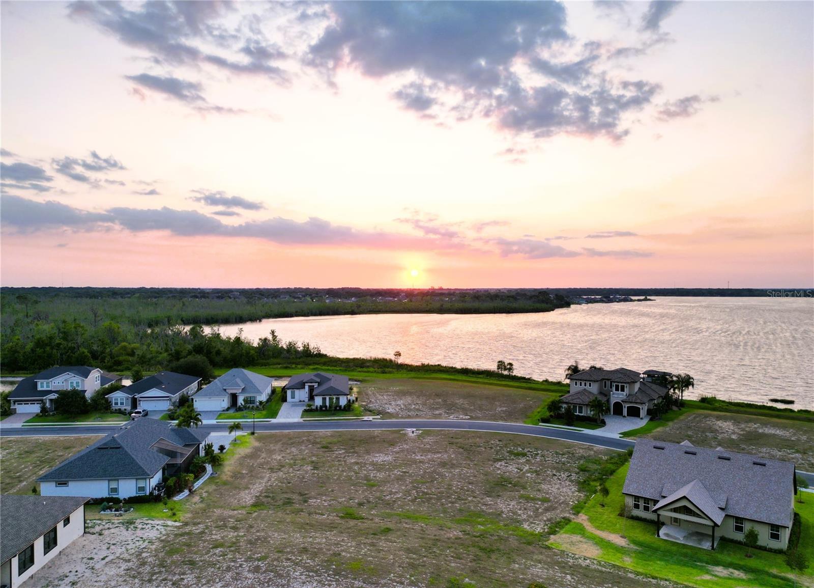 Build your custom home on this beautiful, OVERSIZED lot with a partial view of Lake Van! The lot's larger size offers wide variety of house designs and its location in the neighborhood offers less through traffic. Water Ridge is a one of a kind, upscale, gated community, situated amongst 3 lovely lakes. The community itself provides great amenities such as multiple tennis and pickleball court complexes, 3 pools, boat ramps, access to all 3 lakes, gym facilities, boat storage, community fishing docks and a beautiful club house. It is conveniently located between Tampa and Orlando off the I-4. Close to Universal Studios, Disney Parks, Adams Estates, Shopping, Restaurants and much more!