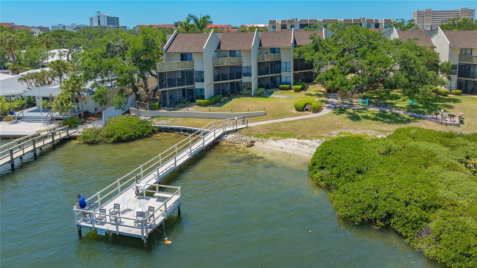 Under contract-accepting backup offers. PRICED FOR QUICK, AS-IS SALE - Lowest price per sq. foot condo on Island! Siesta Key Waterfront for a Great Price! TWO-STORY, 2 BEDROOMS, 3 BATHROOMS, & 1-WEEK RENTALS PERMITTED gem in the popular Bay Oaks community. This spacious condo features two oversized ensuite bedrooms, a guest half bath, and three private lanais—two of them covered, and two with stunning Intracoastal Waterway views. Sip your morning coffee or evening cocktail while watching boats drift by from your living room or lanai—paradise found!
Whether you're looking for a smart investment with income potential or your own personal beach sanctuary, this is a rare opportunity to own on world-famous Siesta Key at an amazing value. Just a short walk to Crescent Beach access points #12 and #13, where you'll find the powdery white quartz sand that’s cool to the touch and consistently ranked among the best in the world.
Bay Oaks offers a peaceful tropical setting, yet you're close to it all—fine dining, pubs, shopping, and fun in the sun. The free Siesta Key Breeze Trolley stops right in front of the complex, making it easy to explore the island without ever needing your car.
Don't miss your chance to own this slice of island life—it’s beautiful, versatile, and priced to move!